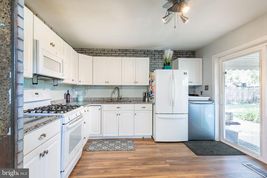 Sweet Three bedroom rancher with high end vinyl water resistant hardy flooring replaced in 2020 and updated kitchen in 2018 with white cabinetry, silver pulls,  granite counters with room for a table and an exit to a covered patio area and a great level fenced yard for your two or four legged friends. A newer ( 2020) big shed is secure for your motorcycle or toys and plenty of room for a garden. The gas furnace/air was replaceed in 2019 and the water heater in 2020. Doors have been replaced with 6 panel doors, ceiling fans to lower utility bills, newer crystal glass door shines light throughout. Big storage room holds the dryer which could also hold the washer with some plumber tweaks.  Public water, public water and warm efficient gas heat and gas stove makes life easier. Sidewalks in neighborhood with easy walk to the elementary school and community water access, pool, boat ramp and recreation at the end of Paul Marr Road. Voluntary community association with small fee for boat ramp.
Easy access to 695, NSA, Fort Meade, BWI, Baltimore and DC! Seller is retiring to the beach and wishes for and end of August closing and has priced it to sell!  Community boat ramp and pool are at the end of Margate Road!
OPEN HOUSE SUNDAY THE 14th 10-1 Come hungry and prepared to fall in love!