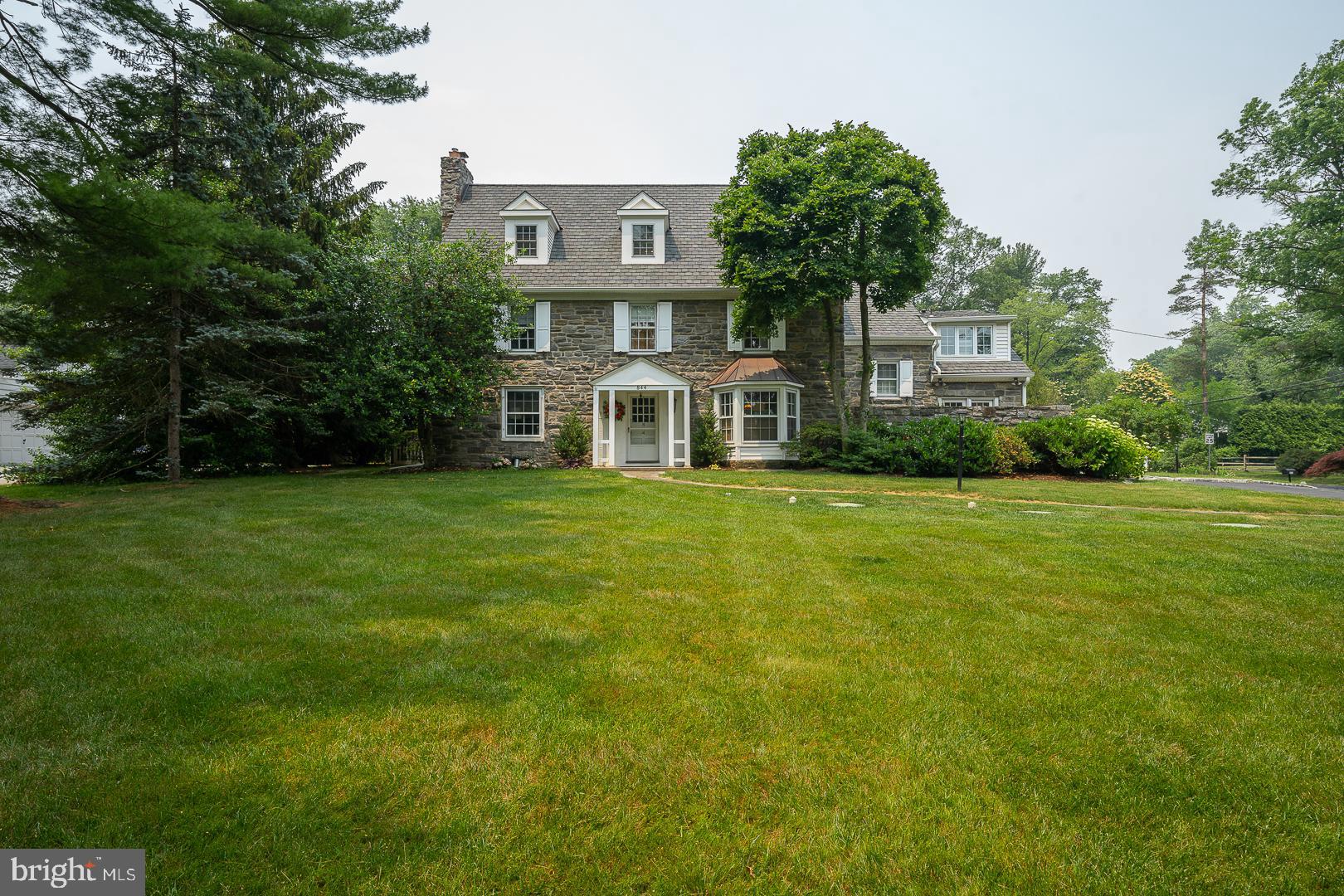 It does not get better than a Main Line Gladwyne home with 2023 amenities. Surrounded by a manicured lush landscape offering total privacy. The one acre lot is flat and has all useable open space. This center hall home has a large living room with a fireplace and French Doors to the rear of the property. For working at home space the 1st floor study has views of the Pergola and property. The dining room opens to the gourmet kitchen any cook would love. It offers a Bluestar commercial range with multiple burners and over sized hood. It has stainless steel appliances and pantry closet with an extensive island . Open to the kitchen is an expensive table that seats at least 10 and has the 2nd fireplace. The Family Room addition is especially awesome. This room is 34x23 has a souring ceiling with a 3rd fireplace. You will surely be designated to host all sports events starting with the Super Bowl. Along a wall are French Doors leading to the inviting slate Patio great for entertaining, relaxing or just reading a good book while siting around the fire pit. The exterior also has fans for hot days and heaters for cool nights. The main bedroom has been expanded with seating area and large walk-in closet. The bathroom has a soaking tub, separate shower and double vanity. There is 2nd ensuite bedroom, a 3rd bedroom and hall bath. The 3rd level has a 732 SF expansion to accommodate a large bedroom, bathroom addition and seating room that could be a 5th bedroom.. The lower level is completely finished gym and recreation spaces. If you desire a wine room this level has one that will receive 1000 bottles. The upgrades are so vast they are listed on a separate sheet. This includes the $40,000 roof electrical, garage doors, plantings, fencing and much more. Enjoy a location minutes from school, restaurants, golf courses and Suburban Square while living in this desirable location. ***View the VIDEO Tour and List of improvements by the Sellers!