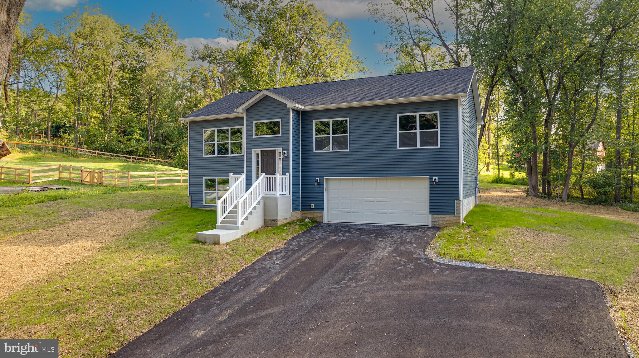 BRAND NEW HOME with immediate delivery that features three bedrooms, three full baths, two car garage, spacious rear deck and more. Located close to MD VA Corridors and minutes to all intown connivences. Builder upgrades include luxury vinyl plank flooring, stainless steel appliance package, granite countertops, tile shower, and more. Finished lower level has a recreation room which could be used as a fourth bedroom if needed and also has a full bath as well. One year builders warranty included.