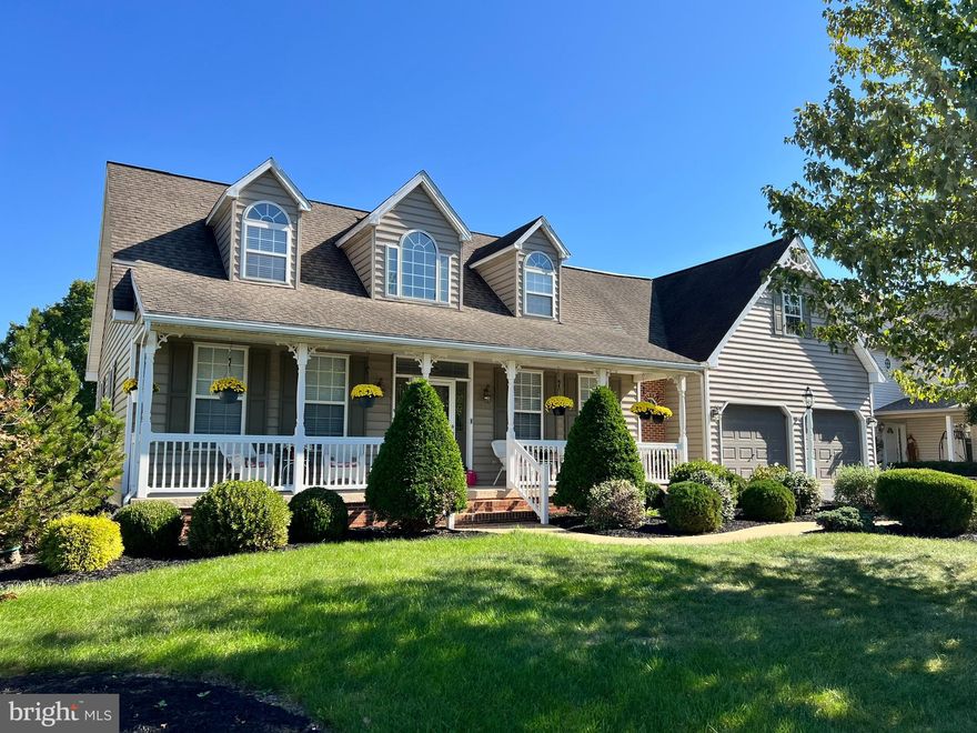 Welcome to this stunning Cape Cod-style home, perfectly situated in a highly sought-after location! With five spacious bedrooms and four and a half baths, this home offers exceptional living space for both comfort and utility. The open-concept living areas are flooded with natural light, creating a warm and inviting atmosphere throughout the home. A thoughtfully designed kitchen with County Craft cabinets and granite countertops seamlessly flows into the living and dining areas, making it perfect for both entertaining and daily living. The inviting primary suite is conveniently located on the first floor, providing easy access and a serene retreat with its own private bath and walk-in closet. Designed with versatility in mind, the finished basement features a charming in-law suite complete with a full kitchen and dining area, a huge family room, a spacious bedroom and a full bath, ideal for multi-generational living or hosting guests. Glass double doors provided a private entrance and direct access to the rear patio that overlooks the back yard. Additional features include a rear deck and covered front porch for outdoor enjoyment, ample storage space in the unfinished room on the second floor, central vac and new paint throughout most of the home. This home is ideally located, offering easy access to local amenities, schools, and parks.