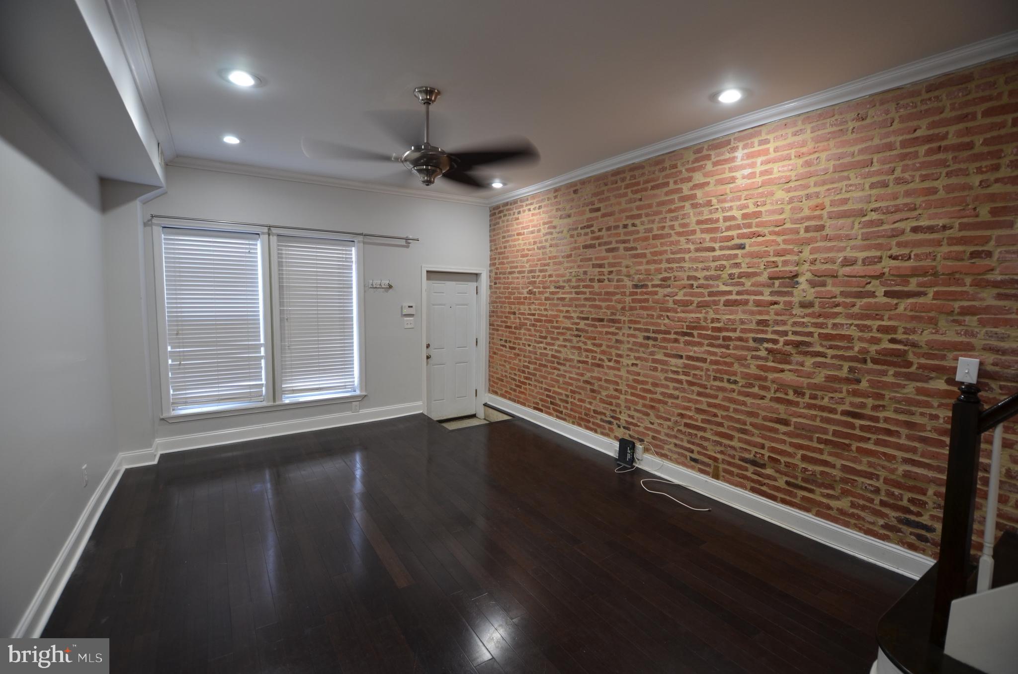 Three bedrooms upstairs with small 3rd room used as office with skylight and basement has full bath and potential for bedroom. Many upgrades: gourmet kitchen with center island, brand new dishwasher, granite counters, stainless steel appliances, mahogany bamboo flooring, exposed brick throughout, recessed lighting, double sink in upstairs bathroom. Rooftop deck and 2nd floor deck off the one bedroom.