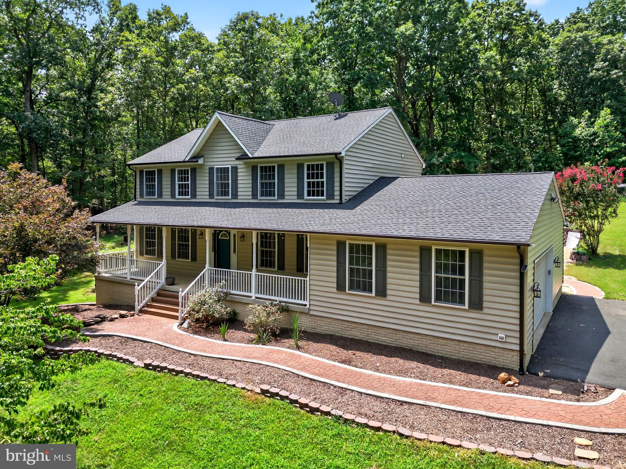 Welcome to your private 6.4-acre farmette retreat with NO HOA! This beautifully updated colonial offers the perfect blend of country charm and modern living. A newly paved driveway winds its way to the secluded home, and a stamped concrete walkway welcomes you to the inviting front porch. Inside, the main level features hardwood flooring, a formal dining room on the right, and an open living room on the left, with a wood burning fireplace & brick mantel. Enjoy the renovated kitchen with granite counters, black stainless appliances, Bosch dishwasher, and island. There is a pantry closet in the kitchen, and an oversized pantry room in the adjacent hallway. The main level bedroom has a closet, tile flooring, walk-out door, & new exterior deck/steps, and is currently set up as an entry room with a built-in hall tree. Upstairs, the owner’s suite includes a soaking tub, double vanity, and walk-in closet with built-ins. There are two other bedrooms on this level, along with the hallway bathroom and laundry room which have both been beautifully updated. The finished basement offers a 5th BR (NTC), full bath, home gym, office/storage room, recreation room (with game table lighting), and a storage/safe room. Outside, entertain on the multi-level deck, relax by the pool, or gather around the stone firepit, with a stamped concrete walkway and patio. Bring your animals—the property is ready for chickens, goats, and more! The exterior also includes a large shed, chicken coop area, animal shed, raised garden bed, target range, and trails around the property. Other updates in recent years include the roof, black gutters, HVAC systems, Nest thermostats & sensors, water heater, basement walk-out door, ceiling fans, light fixtures, video doorbell, pool equipment, generator switch, and whirlpool water softener. Fawn Hills offers a prime location, minutes from commuter routes, shopping, schools, historic battlefields, the Hunting Run Reservoir, & Rapidan River access. Xfinity high speed internet is in place, great for remote work and streaming. Don’t miss your opportunity to be the next owner of this amazing property!