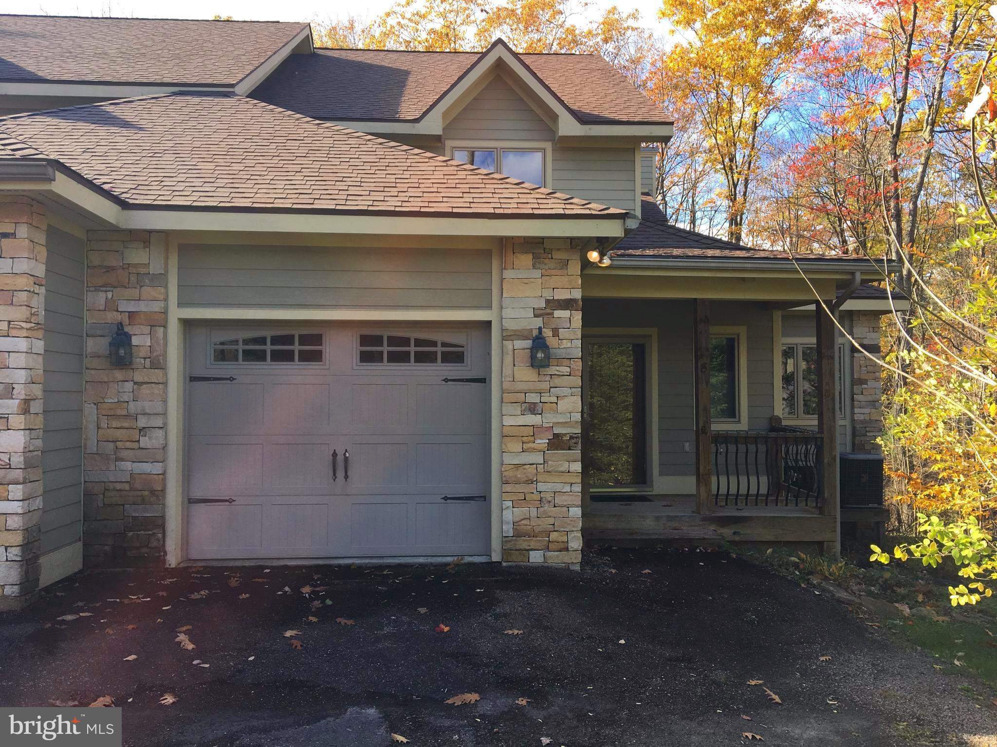 Immaculate 5 BR, 4 1/2 BA dream home in Deep Creek Lake. 3 Master suites! Convenient to mid lake, yet nestled in a beautiful wooded setting. Top of the line construction-3 level open floor plan w/attached garage. Remodeled basement area w/ wet bar and walk out to your 2 tiered deck, hot tub and view of wooded area w/creek. Convenience and privacy all in one, lots of space for everyone!