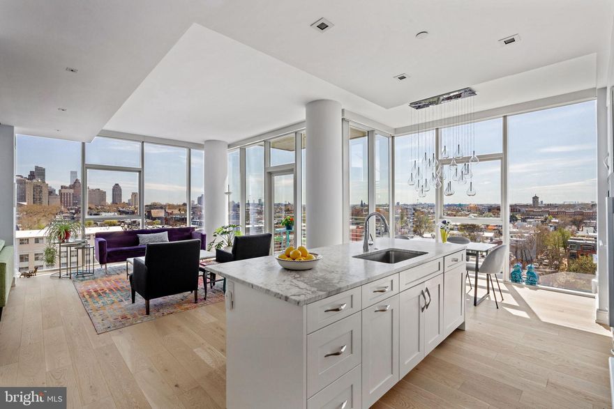 Designed by the renowned architect Cecil Baker and developed by Carl Danoff, One Riverside is the ultimate riverside luxury condo building. This one-bedroom, one-and-a-half-bathroom unit boasts floor-to-ceiling windows with sweeping city and park views, dark hardwood flooring, 10’ ceilings, high-end finishes throughout, and a 1-car parking permit. Originally a two-bedroom, two-full-bathroom floorplan, this unit can easily be converted back to its original state. 

Shaker-style cabinetry is accented by sleek stainless steel appliances in the kitchen including a Miele 5 burner gas cooktop with vent hood, inset sink, wine fridge, wall oven, and built-in microwave. Enjoy meals in the adjoining breakfast area overlooking the open living room or outside on the private balcony overlooking the park. A convenient powder room sits just off of the living space for guests. 

A wall of built-in cabinetry fills the tv room with additional storage that can easily be converted back into a second bedroom. The hardwood flooring continues into the spacious primary bedroom with abundant built-in storage. The spa-inspired ensuite bathroom is adorned with an oversized soaking tub, a glass-enclosed stall shower with a rain head, and a large storage vanity.   Upgrades include custom blinds throughout, a custom lighting package, a significant pantry area, office space, and dual zone HVAC.

Amenities of One Riverside include 24-hour concierge, valet garage parking, secure bike storage, 60' indoor lap pool with outdoor sun terrace, state-of-the-art fitness center (with locker rooms, shower, sauna, and steam rooms), hospitality suite, terrace with outdoor grill, private garden, club room featuring fireplace and catering kitchen, fully-equipped business center with executive boardroom, and chauffeured town car. 
One Riverside sits next to the Schuylkill River Trail within walking distance of Fitler Square Park, Rittenhouse Park, 30th Street Station, Penn Medical Campus, and many award-winning restaurants.