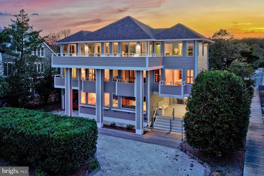 Welcome to 30004 Surfside Drive located in one of North Bethany's most coveted gated communities! Situated on a premium lot, offering ocean views and direct walkway access to a life guarded private beach. Designed with contemporary flair, this custom-built home showcases meticulous craftsmanship and has been lovingly maintained by the original and current owner. Boasting an intelligently designed inverted floor plan with an elevator, the main living and entertaining spaces grace the third floor. Here, a bright and airy living room, open dining area, family room, four-season sunroom, and a well-appointed kitchen with quartz countertops and upgraded appliances flow seamlessly onto an expansive front and rear decks. This area is perfect for hosting gatherings while soaking in the ocean vistas. Large windows adorned with custom plantation shutters flood the interior with natural light, creating an inviting and elegant ambiance. The second floor is dedicated to comfort, featuring five bedrooms and an additional rear deck overlooking a lush and private backyard. Downstairs, the first floor welcomes you with an inviting foyer, an ensuite bedroom, a family room, and a utility room with laundry. Outside, a spacious carport, two outdoor showers, and ample storage spaces cater to beachgoers' needs. The oversized 75 x 158 lot presents endless possibilities, including the option for a pool installation. The property comes fully furnished and boasts strong rental potential. Recent upgrades include a newly installed roof, decking, hot water heater and freshly painted exterior. With no rental obligations for the summer of 2024, this exquisite home is ready for immediate occupancy. Although never rented, a rental projection investment analysis is available upon request. Don't miss this opportunity to experience coastal living at its finest- Call for a private tour today!