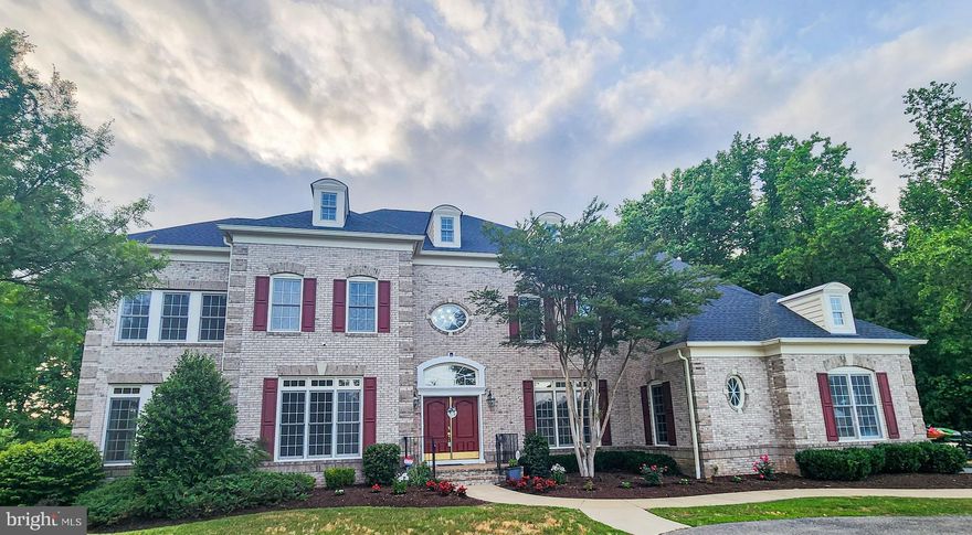 **BACKUP OFFERS WELCOMED** WELCOME HOME TO WONDROUS WINDSONG! Experience the Elegance and Grandeur of this Spectacular Colonial Residence Located at 6505 Osborne Hill Dr. This Eight Bedroom, Seven Full and Two Half Baths Property Offers Approximately 9,000+ Finished SQFT of Living Space and is Situated on a Two-Acre Lot. MAIN LEVEL French-Door Entrance Opens to a Grand Two-Story Foyer with a Dramatic Curved Staircase Accented with Wrought-Iron Spindles Leading to the Sleeping Quarters. The Heart of the Home Features a Separate Living Room with Classical Roman Columns, Gleaming Hardwood Floors, and Crown Moldings; Large Dual-Entry Office with Work-Space for Two; Large Sun-Drenched Solarium Surrounded with Floor-to-Ceiling Windows; Formal Dining Room Boast a Tray Ceiling, Crown Molding, Chair Railing, Wainscotting, and Leads to the Butler’s Prepping Pantry; Generously Sized Gourmet Kitchen Offers Tons of High-End 42" Cabinetry, Granite Counters, Large Chef's Island, Breakfast Bar, Top of the Line GE Monogram Stainless Steel Appliances to include a Six-Burner Stove, Double Wall Oven, NEW Refrigerator, Recess and Pendant Lighting, Spacious Eat-In Area,  Walk-In Pantry, and Work Desk with Built-ins for Multi-Functionality. Adjacent to the Kitchen is the Sunroom with Additional Barstool Seating and Tons of Windows for Viewing the Huge Backyard; Off the Kitchen and Sunroom is Access to the Rear Low Maintenance Composite Deck. Kitchen Also Opens to the Family Room with a Stunning Coffered Ceiling, Built-In Speakers, and a Stoned Gas Fireplace; Pass through the Mud Room to the Oversized Laundry Room with Newer Appliances (2022) and Utility Sink, Full Bath for Pool Guests, and Side Entrance from Driveway. UPPER LEVEL Houses Five Large Bedrooms and Four Full Baths; Primary Bedroom is an Owners' Retreat with a Three-Sided Fireplace Separating the Bedroom from the Primary Living Room with Tray Ceiling and Accesses a Large Covered Private Balcony Overlooking the Scenic Backyard and Pool; Primary Luxury Ensuite Bathroom Has It All – Two Water Closets, Separate Vanities, Jetted Soaking Tub, Oversized Spa Shower with Multiple Shower Heads and Dual Entry, Customized Walk-Through Closet with Attached Dressing Room and Additional Walk-in Closet. A Second Bedroom Suite Encompasses its Own Sleeping Area, Separate Sitting Room, Ensuite Bath, and Two Walk-in Closets. Bedrooms Three and Four Share an Upgraded Jack and Jill Bathroom. Bedroom Five Includes a Private Bath and Walk-In Closet. Hallway Adorned with Crown Molding, Wainscotting, Two Wall Niches, Hardwood Flooring, Recess Lighting, and Back Staircase Leading to the Kitchen. LOWER LEVEL Presents an Enormous Fully Finished Entertainers Basement with an Open Concept Recreation Room, Outfitted Wet Bar w/Barstool Seating, Dance Floor, Theatre Room with Surround Sound, Smart Projector, and Theatre Chairs Convey, Bedrooms Six thru Eight, Two Full and One-Half Baths, and SGD to Walk-Out to Backyard. INTERIOR Enhancements Include Central Vacuum System w/Powered Under-Cabinet Built-in Sweepvac, Built-In Speakers on Main & Lower Levels, Two Fireplaces, Elegant Full-Trim Package, Hardwood Flooring, Modern Ceiling Medallions, Bell Curved Archways, and Intercom System. EXTERIOR Welcomes You Up the Private Driveway to the Impressive Circular Driveway, Stately Brick-Front with Quion Corners, Oversized Three-Car Side-Load Garage, Rear Outdoor Speakers, Walkway/Sidewalk Escorts Guests to the HUGE Leveled Tree-Lined Backyard and Gated Sparkling Inground Pool for Outdoor Living and Entertainment. ADDITIONAL AMENITIES Include Three-Zoned HVAC System, 9' Ceilings, NEW Roof (2024), NEW Hot Water Heater (1 of 2 in 2023), NEWER Washer & Dryer (2022), and Two-Year Transferrable Home Warranty from the Sellers. RTS is the Preferred Title Company. Schedule Online to Find YOUR Dream Home.