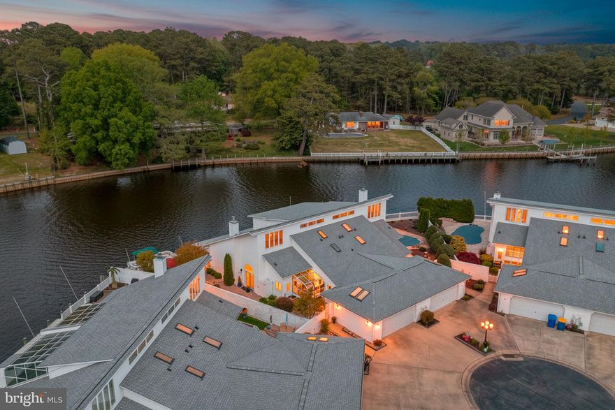 Welcome to 16 Hunters Point—an updated waterfront home offering style, comfort, and direct boating access. Interior features include luxury vinyl plank flooring in the lower-level guest bedroom, all baths, laundry, and kitchen. The primary suite showcases a soaking tub, new tile surround, updated vanity, and backlit mirrors. Recessed lighting has been added to the kitchen and primary bath. Recent upgrades include a new roof (2025), new garage door (2025), 40,000 BTU propane fireplace with stone surround (2025), HVAC with 10-year warranty (2025), and hot water heater (2023). Enjoy coastal living with a private 64’ dock just steps from your back door, complete with electric and water, providing access to the Indian River and Indian River Bay. Take in peaceful views and a true front-row seat to waterfowl and birdwatching right from your own backyard. Outdoor features include low-maintenance hardscaping, professional landscaping with irrigation, propane fire feature, outdoor shower, outdoor lighting, and storage shed. Conveniently located near parks, dining, shopping, and Route 113, with easy access to Lewes, Rehoboth, Bethany, Fenwick, and Ocean City.