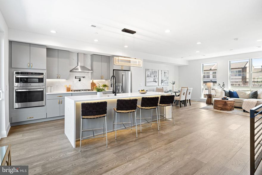 WOW  up to a 25K Seller Credit offered toward builder upgrades! Positioned between Fairmount and Northern Liberties is The Residences at Park Avenue, a community of 28 semi-custom 21.5' ultra wide homes scheduled for completion in the Fall of 2022. For a limited time, these homes are available at a pre construction price with opportunities to customize. Statement-making lighting pieces hover proudly as you enter the first floor where you’ll find a bedroom, full bathroom, and bright office area. Wood flooring, designer light fixtures, and strategically placed accent lighting are just a few of the high-end features that adorn these homes. Heading upstairs you will find the open concept floor plan that allows the living and kitchen areas to blend seamlessly together. Exploring every corner of this floor, you will discover convenient features designed for entertaining and everyday life. The kitchen area features a quartz island with optional elegant under-counter lighting and tambour paneling, GE appliances, and soft close cabinetry. To create intimate evenings with family or friends, opt for the built in Sonos speaker system, smart lighting controls to dim the lights, and craft a cocktail at the built-in beverage & wine station. Then open the sliding doors off the living area to your second floor patio to enjoy an evening under the stars, a space perfectly suited for morning pastries and coffee to grilling and cocktails. The third floor bedrooms are bright open spaces that can be upgraded with custom closets and smart lighting systems. Entering the main bedroom you’ll love the spa-like bathroom with finishes thoughtfully selected by professional designers, optional heated floors extending into the shower, and a frameless glass shower. Finally, the fourth level is your outdoor oasis– a 400+ sq ft deck with views of Center City and Northern Liberties. Choose to furnish this space with a pergola, decorative string lights, outdoor Sonos speakers, and accent lighting for a truly turn-key outdoor area that will inspire your next alfresco dinner or intimate soiree. With tech & security features that can create the foundation for a true “smart home” ecosystem, your wildest Alexa and Google home capabilities come to life. Complete this setup with electricity & water meter monitors, smart door locks, wifi boosters, and a 2Gig Edge All-In-One-Interface– every inch of this home can be prepped to create end-to-end technology experiences. At The Residences at Park Avenue, you have the best of both worlds, one where you have instant access to sophisticated dining and an urban feel. Hop on the Broad Street Line and see a show, or remove yourself from the hustle of the city in the greens of Fairmount Park. Steps away from your front door are convenient everyday spots like Aldi, Santucci’s Pizza, and numerous cafes or coffee shops. After your day is over, a convenient night out at The Met, Osteria, Cicala, Thirsty Dice or the speakeasy at the Divine Lorraine are all within a 5 minute walk. Notable standard features of these homes include a double carport, 9ft ceilings, a finished basement, and a FULL 10 yr tax abatement. Buyers can also choose to take their home to the next level with optional upgrade packages that include curved waterfall islands, outdoor decks, indoor and outdoor Sonos speaker systems, electric vehicle charging stations, smart lighting, tankless water heaters, wine & beverage centers, GE Cafe appliances, and much more. A la carte upgrades can include electric vehicle charging stations, additional powder rooms, and pantries. Contact us for a detailed view of the upgrade packages. Don’t miss your chance to own one of these incredible homes at The Residences at Park Avenue. Total square footage includes a fully finished 711 sq. ft basement. Schedule your showing today!