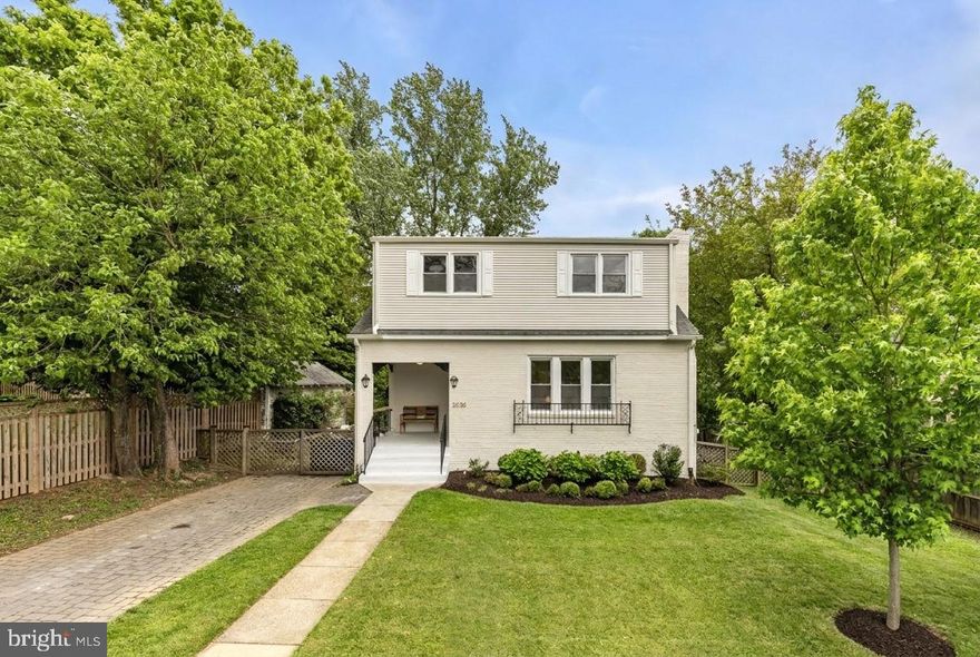 Tucked into the sought-after North Woodside neighborhood, 2030 Luzerne Avenue offers the perfect blend of charm, community, and convenience just moments from Downtown Silver Spring and easy access into Washington, DC. Known for its tree-lined streets, welcoming atmosphere, and walkable feel, North Woodside is one of Silver Spring’s most beloved neighborhoods. Positioned directly across from Woodlin Elementary School, the home offers an exceptionally convenient daily rhythm with parks, schools, neighborhood gatherings, and everyday amenities all woven seamlessly into the surrounding community.  Enjoy close proximity to Downtown Silver Spring dining, shopping, parks, entertainment, Metro access, and popular local destinations including Zinnia, All Set Restaurant & Bar, Quarry House Tavern, Sligo Creek Park, and Woodside Urban Park.

Set back from the street on a generous lot, this home offers both privacy and inviting outdoor living. A charming front porch provides the perfect place to enjoy morning coffee or unwind in the evening. The fully flat, fenced-in backyard features a brick patio, gardening beds, a storage shed, and expansive green space to run, play, entertain, or relax, along with thoughtfully designed hardscaping that enhances both function and curb appeal.

From the moment you walk in, the home feels bright, warm, and easy to settle into. Large windows fill the living room with natural light, while the fireplace gives the space a cozy focal point. It’s easy to imagine summer days with the front door open, everyone moving in and out, kicking a ball in the yard, enjoying the freedom and space to play and gather. In the colder months, the living room becomes the heart of the home, a place to cozy up by the fire for favorite board games, movie nights, and quiet evenings together 
The kitchen is one of those spaces that naturally becomes the center of daily life, designed as much for gathering as it is for cooking. With generous storage, expansive countertops, and casual island seating, there’s plenty of room for everything from weeknight dinners to lingering conversations over coffee or homework at the counter. Thoughtful design details, beautiful lighting, and sunlight streaming in from the backyard make the space feel bright, welcoming, and genuinely enjoyable to spend time in. Overlooking the backyard and opening easily to the patio, the kitchen makes everyday living feel effortless, whether keeping an eye on play outside, entertaining friends, or moving seamlessly between indoor and outdoor meals on warm evenings.  With four bedrooms, as well as a flexible lower level with a spacious laundry room, 2030 Luzerne Ave has the ability to evolve as your needs grow and change over time.

Recent improvements throughout the home make settling in feel easy and effortless. The kitchen has been thoughtfully updated, while the bathrooms have been completely reimagined with a fresh, refined feel. The home has also been painted inside and out, and extensive hardscaping and landscaping add both beauty and functionality to the outdoor spaces. Carefully selected light fixtures bring warmth and personality to each room, while the updated fireplace hearth, finished with a striking carbon gray quartzite slab, adds a subtle sense of sophistication to the living space.  The roof was replaced in 2018, and hardwood floors were seamlessly extended from the dining room into the kitchen.

2030 Luzerne Avenue presents a rare opportunity to own a thoughtfully updated home in one of Silver Spring’s most neighborly and convenient communities.