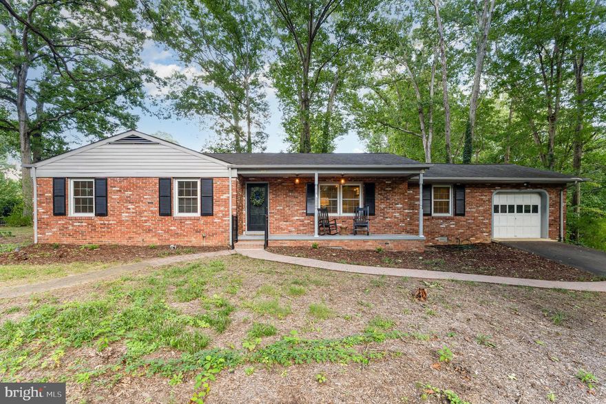 Location, location, location! This charming rambler offers main-level living on a cul-de-sac half-acre lot in the sought-after community of Argyle Heights. With over 1,600 finished square feet plus an unfinished basement for storage or future expansion, this home combines the character of a classic rambler with thoughtful updates. The open floor plan features built-in shelving, a wood-burning fireplace, three bedrooms, and two full baths. Additional highlights include an attached garage, fenced rear yard, recently replaced architectural roof, natural gas HVAC, water heater, whole-house Generac generator, and new dishwasher, washer, dryer, and freshly refinished floors. Relax on the welcoming front porch or enjoy the natural setting from the brick paver patio. Conveniently located just 5 minutes to Downtown Fredericksburg, the VRE, and commuter lots, with an easy drive to Dahlgren and Quantico. Don’t miss exploring the walkable community and nearby Lake Carroll to truly appreciate this private retreat close to town.