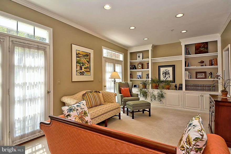 Impeccably maintained former Model home with all the upgrades! HW floors, moldings, plantation shutters and custom built-ins throughout. Renovated kitchen with stainless appliances, granite countertop & breakfast bar.  2 gas fireplaces. Walk-out lower level & large upper level Loft with en-suite bath. Sought after Waters Edge community with pier, walking paths & tot lot. Pristine and move-in ready