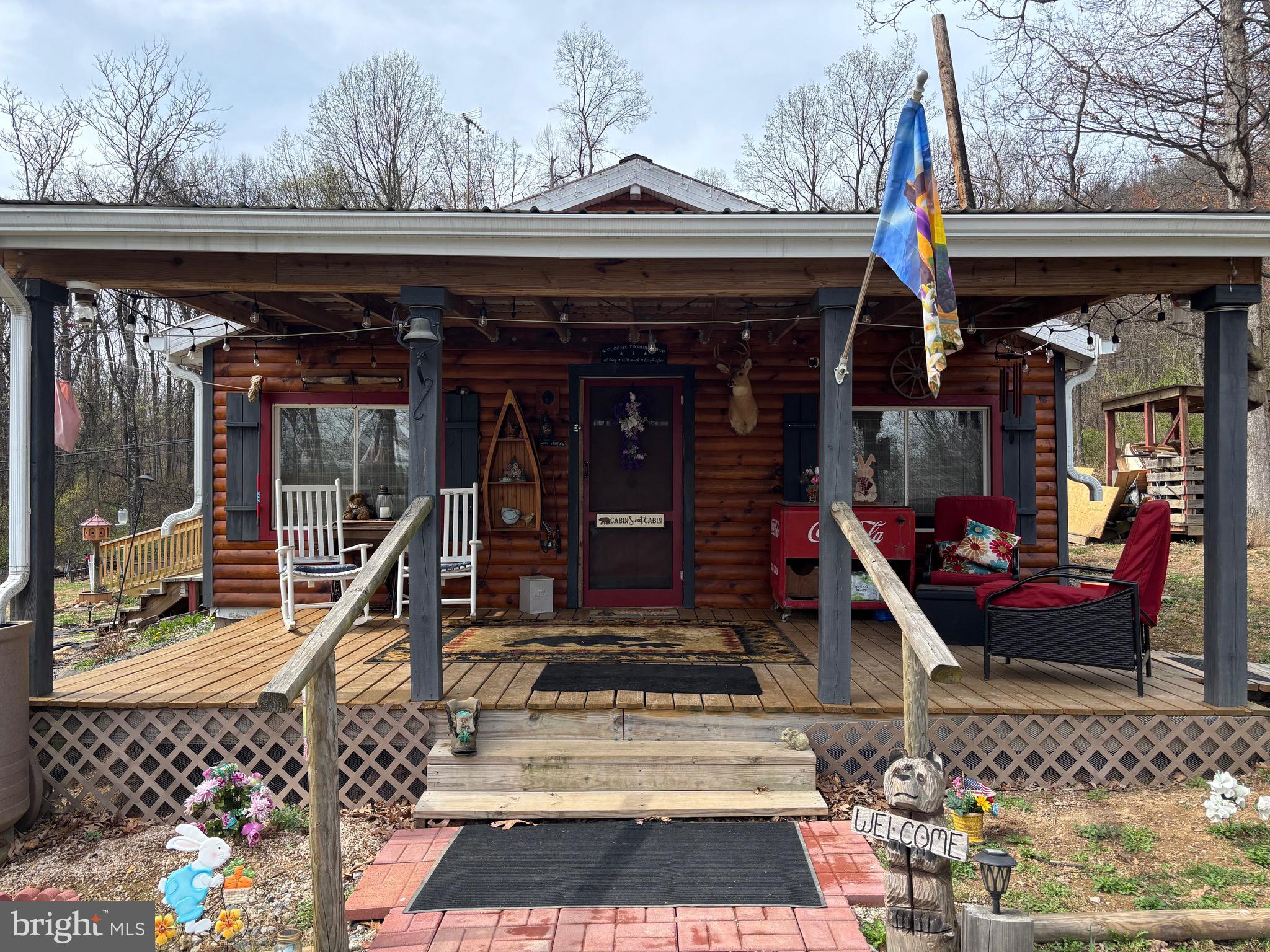Welcome to your dream getaway cabin in Martinsburg, located just minutes from Poor House Farm. This adorable home is the perfect place to escape the stress of work and step into a world of tranquility. Surround yourself with the beauty of nature and peace. The large front porch is an ideal place to enjoy your morning coffee while hearing the sound of rain on the metal roof or for family dinners in the evening. This cabin has everything you need for your weekend getaway or just enjoy this cozy place after downsizing, the possibilities are endless with having 2.5 acres of land. Fence in the property and bring the animals! Total seclusion with a gravel road leading up the mountain, yet very close to town and conveniences. The main house was built in 2019 and is 1 bedroom and 1 bath. An additional home was added last year and is a large room with closets and plenty of space to make it whatever you need. Come see this beautiful property before it's gone.