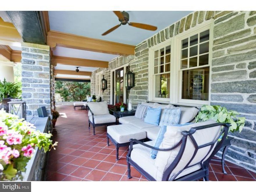 AMAZING opportunity to own a S Wayne classic at a great price and .....If only a porch could sing.. this one would be belting out one of Frank Sinatra's finest!! As you approach this South Wayne beauty you realize something special awaits you, as the magnificent front porch of a by gone era naturally calls one to... sit down, relax, and realize "life is good"! Gas lanterns set the tone and the graciousness of this lovely property exudes from its stunning street presence, to covered portico, to large stone wrap around porch, to glass panned mahogany front door that welcomes one into the grand Foyer. Gleaming hardwood floors, magnificent millwork, and deep silled lead paned windows, are just some of the classic features that can be found throughout this elegant home that truly make it special. Surprisingly for a house of this age, it has a very open floor plan as the Foyer naturally leads to the expansive Living, Dining and Music Rooms. The natural flow continues into the Bar/Pantry Area making it an entertainers dream, and then into the Kitchen, Breakfast Room and Laundry Area. Tucked under the front staircase is the cutest Powder Room you will ever see before the exquisite grand staircase leads you the Second floor. A wonderful Master Bedroom awaits one at the top of the stairs with with His and Hers private Dressing Rooms making it a luxurious Master Suite. An ensuite Bedroom with own private Bath and large closets can be found across the hall. Additionally, there are two other Bedrooms and two Hall Baths. The Second Floor is completed by a wonderful brick walled Gathering/Family Room with  Fireplace that is perfect spot to enjoy a good movie. The Third floor has two Bedrooms, Exercise Room, and updated Hall Bath. One of the original summer homes of the Main Line this property is rich in history and sits on one of South Wayne's finest streets. Walk into Wayne from this tree lined street, but you will always to return to THE most enchanting porch that promises to provide many years of cherished memories!!