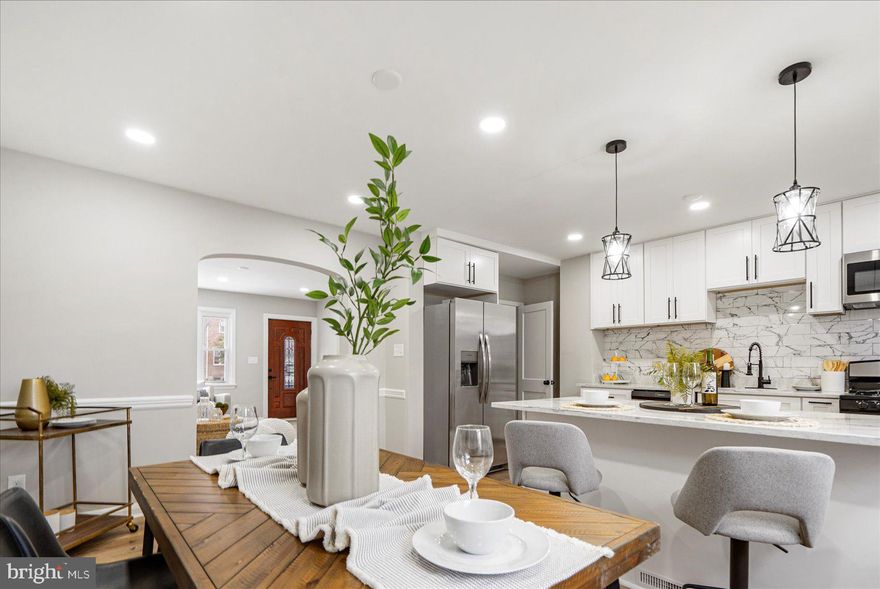 Welcome home! Introducing 1133 Elbank Ave, a gem nestled in the heart of Baltimore, MD. The exquisitely, spacious living room and open concept kitchen as you first walk in,  reflect the natural light that pours in from the large front windows, creating a warm and inviting atmosphere. The open-concept kitchen and dining area are perfect for hosting gatherings. The kitchen boasts granite countertops, and all new appliances including all new shaker white cabinets. Upstairs, you will find three bedrooms with fresh paint, new carpet, and a fully updated bathroom with gorgeous finishes. The fully finished lower level is ideal for additional living space along, with an additional bedroom, and a full bathroom.  The recent top-to-bottom renovation ensures every corner radiates luxury and comfort. Additional upgrades include new HVAC,  electrical,  hot water heater, new appliances, and a new roof. Book your tour today!