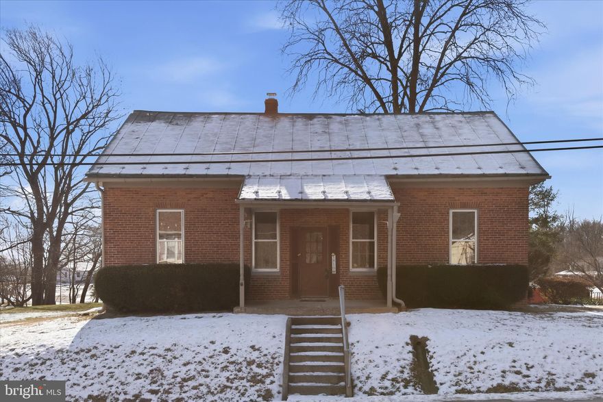 Nestled on over an acre of serene land, this charming circa 1900 former one-room schoolhouse  offers a perfect blend of traditional warmth and modern comfort. With 1,764 sq. ft. of thoughtfully designed living space, this delightful residence features three spacious bedrooms and a full bathroom, ideal for relaxation and rejuvenation. The classic brick exterior exudes timeless appeal, while the expansive lot provides ample room for outdoor activities, gardening, or simply enjoying nature's beauty. Parking is a breeze with a convenient driveway, ensuring you and your guests feel right at home. This property is not just a house; it’s a canvas for your dreams. Embrace the tranquility of country living while being just a short drive from local amenities. Discover the perfect place to create lasting memories and enjoy the comforts of home. Don’t miss this opportunity to make it yours!