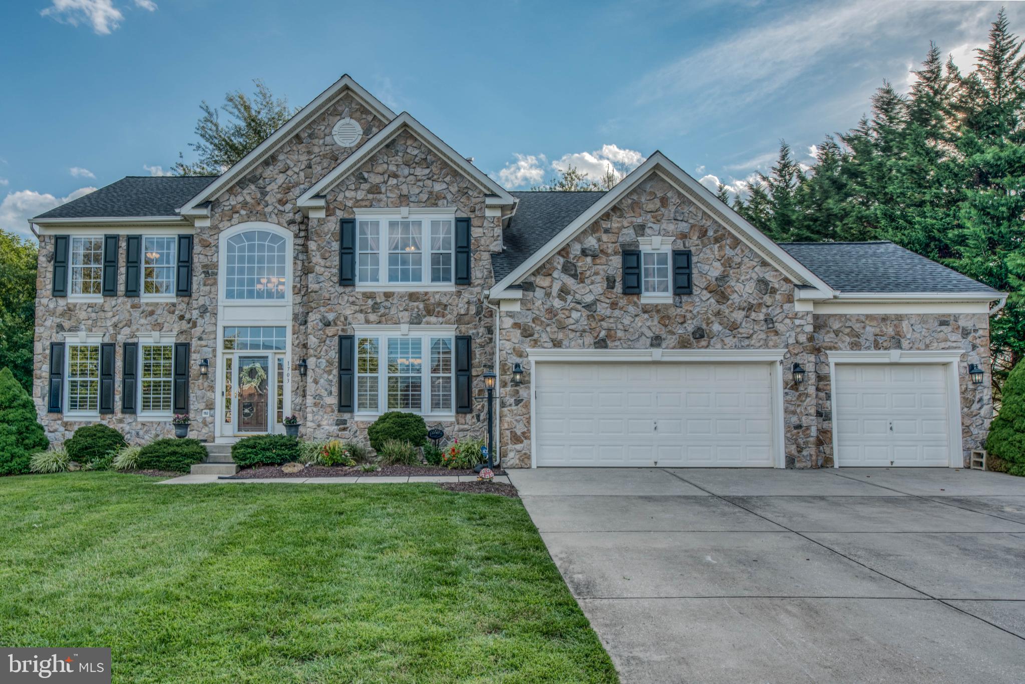 Wonderful home located in sought area of Stone Ridge! Backs to a beautiful private setting. The curb appeal doesn't stop at the door, you will love the open and wonderful feel of this home. Two Story Foyer & Family room with a stone fireplace. Huge living room and dining room with hardwood floors. Spacious Office/Study. Very spacious gourmet kitchen w/Island, large pantry, gas stove with a hood with laundry located off kitchen. The Morning room opens with sliding glass doors onto a wonderful stamped concrete patio, just in time for barbecues & entertaining! The second level features a fabulous Master Retreat w/cathedral ceilings, sitting area, two WIC's and a sumptuous Master Bathroom w/soaking tub & separate shower. Three additional spacious bedrooms and full bath complete the 2nd level. If you still want more space head to the amazing totally finished lower level w/recreation area, comes with theater room (roughed in),exercise area, phenomenal full bath and plenty of storage. 2 Year old HVAC, New Hot water heater, New washer and dishwasher,Also all recessed lighting were installed everywhere on main level & Wooden shutters through out the main floor.Plus a true 3 Car Garage! Don't delay in scheduling your appointment, this home will go super fast!