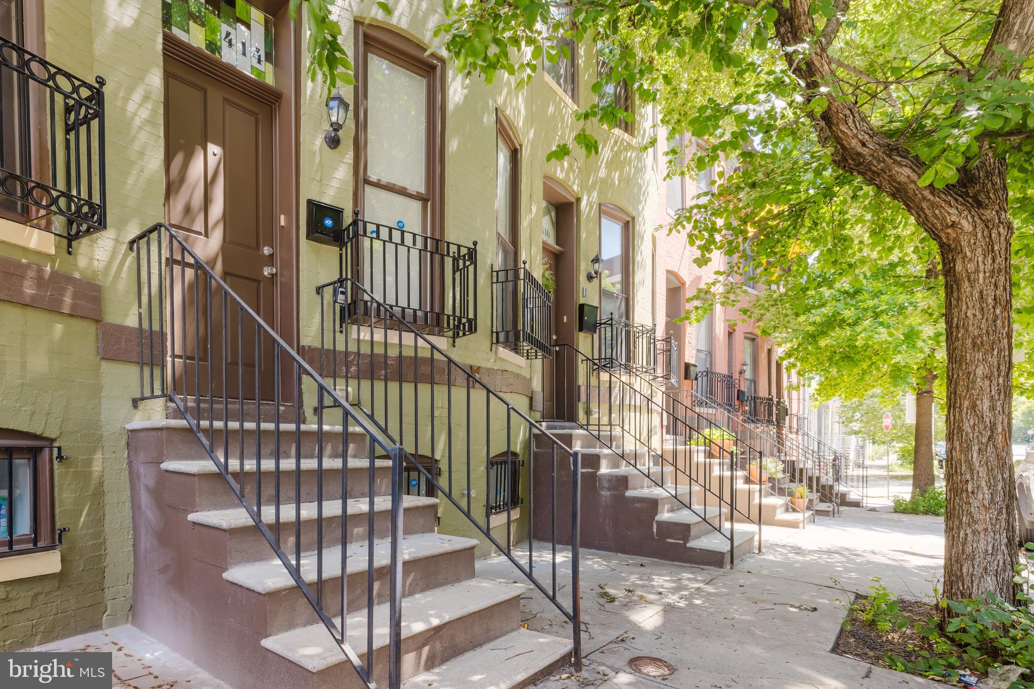 Oliver is one of the most Architecturally Pleasing streets in Greenmount West and this home comes with all it's charm. 5K only available with use of preferred lender (Carli Steiner with First Home Mortgage) and title company (Certified Title). This home is also eligible for grants such as buy back the block (give up to 20K to eligible buyers). Why rent when you can own a piece of Baltimore's rich history? This beautifully updated interior townhome combines historic charm with modern amenities and even includes a dedicated parking space! Step inside to discover an inviting open floor plan, complete with wood floors in the spacious living room. The flowing floor plan leads you to the eat-in kitchen. The kitchen boasts brand-new stainless steel appliances, New granite counter tops and new flooring. Main level also offers a convenient half bath. Upstairs, you'll find two bedrooms with new carpeting and updated full bathroom. The lower level offers high ceilings, a versatile finished space perfect for a home office, gym, or den, plus a full sized washer and dryer for added convenience. This move-in-ready home is the perfect blend of classic Baltimore charm and modern updates on a tree lined street. Don’t miss your chance to call it yours!