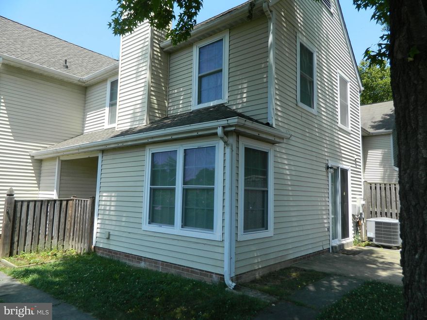 Nice two bedroom  one and a half bath home.  New carpet and updated kitchen.  End of unit with a nice sized yard and shed. Close to everything