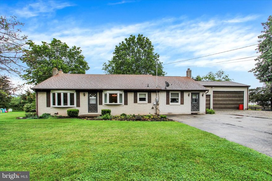 Brick Rancher in a rural setting, private backyard, 2 Bedrooms, 1 1/2 baths, Large living & separate family room on main level.  Family Room with wood stove.  Spacious Country Kitchen has been updated. lower level has rec room with brick hearth & wood stove with bilco door access.  Detached 3 car garage with high doors for those large trucks, etc with side door direct from the deck.   Utility room on lower level has a shower, laundry including washer & dryer, older refrigerator that works great keeping drinks etc cold.