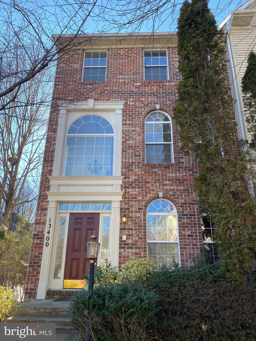 Beautiful end-unit 3 level townhome of 4 bedrooms and 3.5 baths.  Completely  renovated new floors all levels, fresh paint every room and brand new appliances!  2 car detached garages, community pool, tennis courts, high ceilings, fireplace, and more...private fenced deck ! Ready to move in!  No smoking no pets!