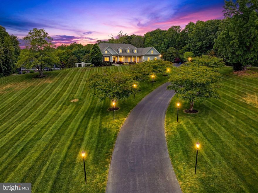 Experience the perfect blend of luxury, privacy, and functionality with this exceptional custom-built Craftsman-style rambler, situated on over 16 acres of beautifully maintained and partially wooded land. Built in 2016, this 7-bedroom, 5 full and 2 half bath estate offers refined living with high-end finishes and thoughtfully designed spaces throughout.

The main level features 10-foot ceilings, rich hardwood flooring, and an open, inviting layout centered around a spacious family room with a gas fireplace. The gourmet kitchen is appointed with custom cabinetry, marble countertops, and premium finishes, ideal for both everyday living and entertaining. The expansive primary suite offers a private retreat with a walk-in closet and spa-inspired bath, complete with a jetted tub and walk-in shower.

The fully finished walkout lower level, with 9-foot ceilings, provides additional living and recreation space, including a dedicated home theater and whole-home audio system. Every room is designed for comfort and entertainment, enhanced by a Control4 smart home system that seamlessly integrates lighting, security, audio, and more.

Step outside to your private resort-style setting featuring a 25x40 heated gunite pool with PebbleTec finish, automatic cover, and extensive hardscaping. The custom pool house is an entertainer’s dream, complete with a full kitchen, wet bar, gas cooktop and oven, dishwasher, refrigerator, and a full bath with laundry. Thoughtful custom woodwork carries throughout the interior and exterior, creating a cohesive, high-end design.

Designed for year-round enjoyment, the pool house is fully heated and cooled and enhanced by integrated surround sound throughout both the pool house and pool area. Both the main residence and pool house feature newly installed permanent Govee lighting, ideal for everyday use or seasonal displays.

The property is further supported by a comprehensive security system, including exterior cameras covering much of the grounds and a full alarm system for added peace of mind.

Additional improvements include a 3-car oversized garage with custom flooring, heating and cooling, a 50x100 pole barn with full concrete flooring, and a custom wood barn equipped with electric, projector, surround sound, and lighting—perfect for multi-use or entertainment space.

The property is further enhanced by a slate front porch and walkway, custom landscaping, black aluminum fencing, and a full-yard irrigation system covering approximately 3 acres. A charming custom-built playhouse mirrors the main home’s architecture, adding to the property’s unique appeal.

Modern infrastructure includes insulated vinyl siding, a whole-home water filtration system, dual tankless water heaters, upgraded well pump (1.5 HP), and a 48kW whole-home generator, ensuring comfort, efficiency, and peace of mind.

This one-of-a-kind estate offers a rare opportunity to own a private, amenity-rich retreat in a highly desirable Southern Maryland location.