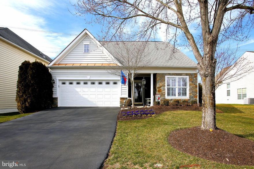 Welcome to an exceptional living experience within the Dunbarton Community. The jewel in the crown of this 55+ gated community in Bristow, VA. This home features luxurious living with a primary bedroom and full bath attached plus a second bedroom and full bathroom that features a walk-in tub and shower, both located on the main level.  The second floor loft with its 3rd full bathroom offers additional living space, perfect  for a craft room, home office or a place for guests to stay!  The cozy living room features soaring ceilings and a gas fireplace.  Luxury vinyl floors (with hardwood look) in the living room, dining room and foyer. A cook's kitchen with beautiful porcelain tile flooring, ample table space and a walk-out to a tastefully done screened-in porch, so you can enjoy meals with a gorgeous view of the private, well landscaped backyard. The community offers a multitude of amenities and activities including: a grand clubhouse; a pool; fitness center; tennis, pickleball and basketball courts; scenic walking trails; plus lots of social activities! One resident must be over 55, and no full-time residents under the age of 18. Buyer pays $3720 capital contribution at closing. (More pictures to come!)