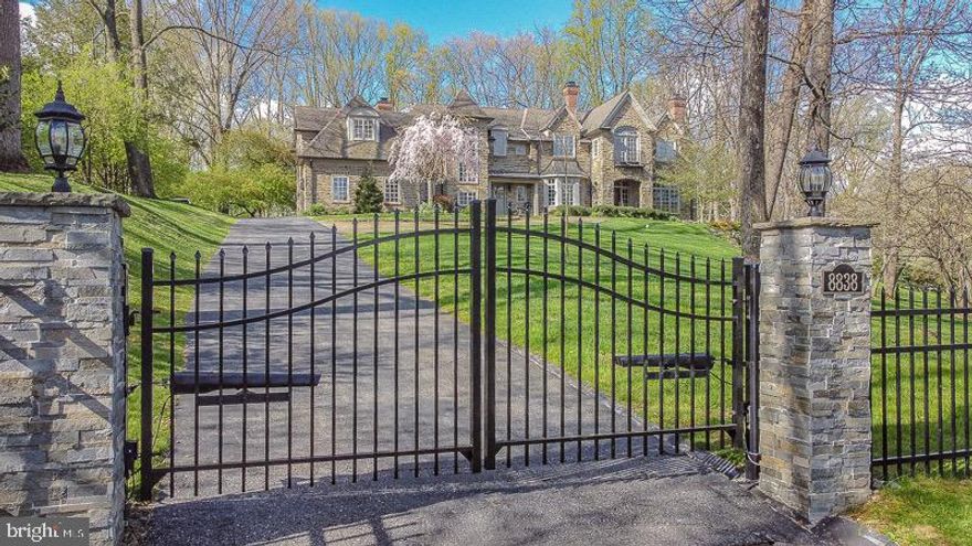 A truly rare offering on highly sought-after Montgomery Ave. in Wyndmoor, this property is majestically situated on almost two acres of land, with sunrise and sunset vistas over the Whitemarsh Valley. A walking distance from Chestnut Hill’s shops and restaurants, and, at the same time, adjacent to a natural reserve, the house offers a convenient solution to enjoy nature in the proximity of a city. Landscaped to blend in with the natural surroundings, the property opens to beautiful, natural woods. Whissahickon stone finishes of the exterior are done in the tradition of home building in this exquisite neighborhood. Inspired by architectural elements of hundred-year old homes in the area, this breathtaking house was built by the highly regarded custom builder Sam Blake. Designed for both elegant entertaining and intimate family life, the interiors are graced with abundant natural light and high ceilings. Upon walking in through the exquisite grand entryway, you are welcomed with floor to ceiling custom molding, which flows swiftly into the adjacent living room. Coffered ceilings and recessed lighting, adding to the elegance of this room. Here you will find the first of five beautiful fireplaces. Make way through the foyer, you will find the formal home office, where mahagony encompances the entire room and another fireplace. Across from the living room, you have the dining room featuring chair molding. Entertainers delight will find resource in the butler area, with a wine fridge, ice maker, and wet bar. The stunning gourmet kitchen with marble countertops features Wolf ovens and Wolf 6 Burner cooktop, and two built in beverage refridgerators. The kitchen has a spacious breakfast area and opens up to the family room, with a fireplace and spectacular custom ceiling molding. The second level with 5 bedrooms, features the main master suite, sitting area, and relaxing master bath, with marble walls and heated marble flooring. The walk out basement features tiled floors, bar area with built in shelving, and a full bathroom. Wine enthusiasts will have a wine cellar to enjoy in the finished basement space. This home is stunning with its 11 foot ceilings on the first floor, plantation shutters on the second floor, a speaker system throughout the whole house. The property is fully fenced and gated. Very private, yet, walkable to local train stations, shops, restaurants, galleries and golf / tennis clubs of charming Chestnut Hill. The location also allows for easy access to some of the area's best private schools, including Springside Chestnut Hill, Germantown Academy and Germantown Friends. Close to bicycle and walking trails of the Forbidden Drive in Fairmount Park and only a short 25 minute drive from Central Philadelphia and 90 minutes to Manhattan. This is truly a special and magical home not to be missed.