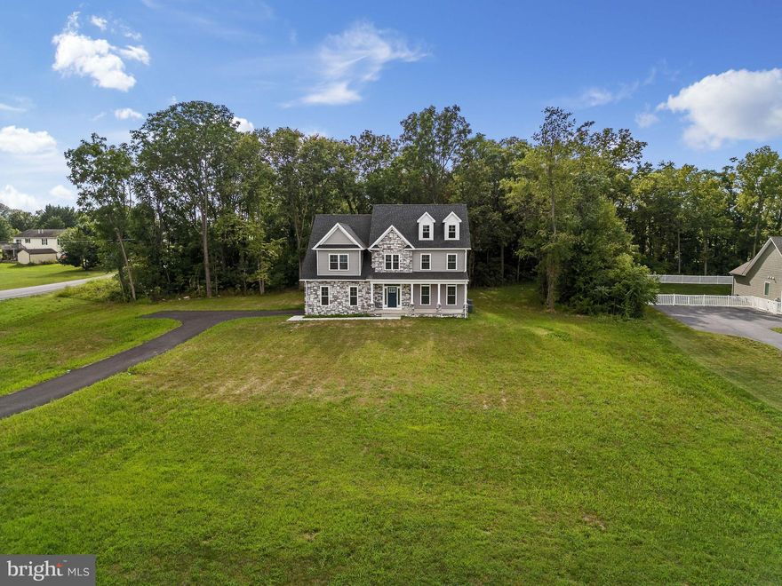 Welcome to the pinnacle of modern luxury in the highly sought-after Spring Mills school district! This stunning 5-bedroom, 4-bath residence, freshly built in 2023, and includes a 1-year builder warranty, is move-in ready and waiting for you to claim it as your forever home. As you step inside, you'll be greeted by a flood of natural light that accentuates every exquisite detail of this remarkable property. The heart of this home is in its gourmet kitchen. With a 6-burner Gastop/electric oven and expansive granite counters, and a spacious island, this culinary haven beckons both the novice cook and the seasoned chef. Flowing seamlessly into the dining area and family room, the setting is perfect for hosting memorable gatherings, especially with the cozy ambiance of the propane fireplace complete with a blower. The Acacia wood floors throughout add a touch of welcoming warmth and timeless style. Versatility takes center stage on the main level, which boasts a convenient 1st-floor bedroom and full bath – a versatile space ideal for accommodating guests, in-laws, or even transforming into a productive home office. The upper level reveals a haven of comfort and sophistication. The large primary bedroom is a true retreat with tray ceilings that lend an air of dimension and refinement. Dual closets ensure ample storage, while the ensuite bath is a spa-like sanctuary, boasting twin vanities, a customized shower, and an indulgent soaking tub. A "Princess suite" stands ready to pamper, offering a generously proportioned bedroom complete with its own private ensuite bath – perfect for hosting special guests or accommodating family members in style. Two additional bedrooms share a thoughtfully designed jack-and-jill bath, ensuring that every member of the household enjoys their own private haven to flourish in.  And don't forget to take note of the exceptional building standards, from the robust 2x6 walls to the impressive R21 insulation in walls and R49 insulation in the attic. Plus, an unfinished basement with rough-ins for a full bath adds incredible potential to your new home. With its meticulous design, upscale features, and location within the Spring Mills school district, this is an opportunity that you can't afford to miss. It's time to experience the epitome of contemporary living – schedule your tour today and embark on a new chapter of your life that's nothing short of exceptional!