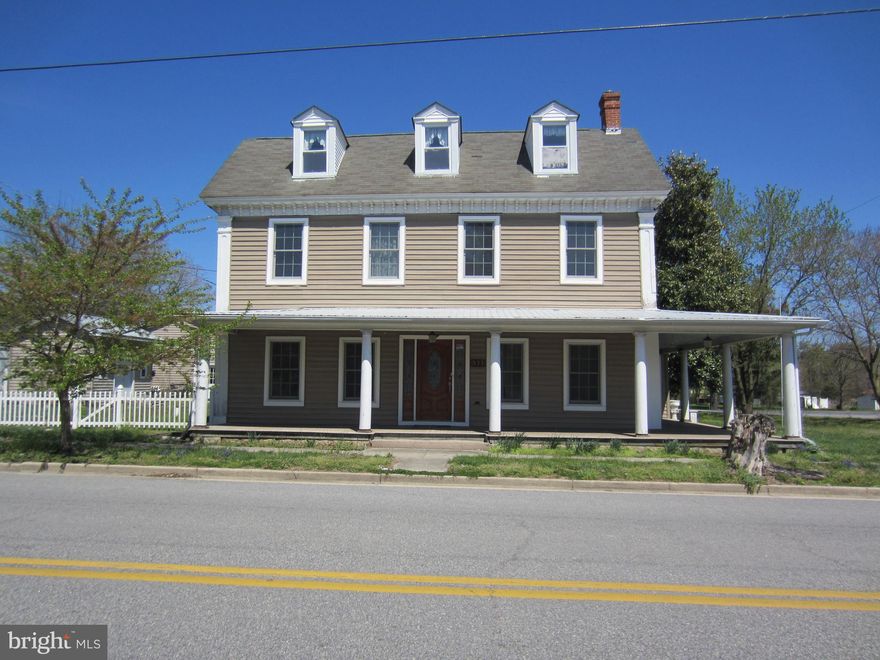 Six bedroom/2 bath house in the heart of Marydel for less than assessed value! Seller has purchased all new Andersen windows - most have been installed and new siding! Beautifully Updated Morning Room with pellet stove and Kitchen with stainless steel appliances, pine beadboard walls, knotty birch cabinets and walk-in pantry. New hardwood floors on main level in Living Room, Family Room and Dining Room. Welcoming wrap-around composite porch on a large corner lot with 12'x16' shed and 24'x32' pole barn with plumbing. Bring your creativity and make this older house a home!