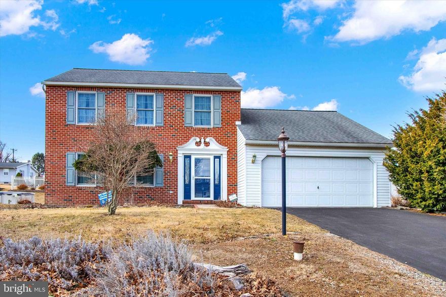 nice colonial home with a 2 car garage,  has updated granite countertops in kitchen and bathrooms, has a full basement