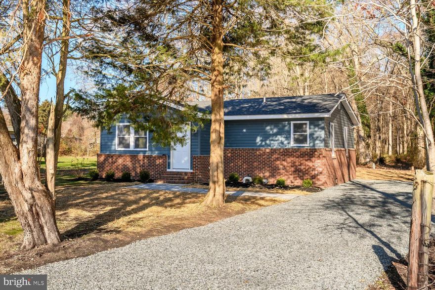 Don't miss the opportunity to own this beautifully renovated home that offers peaceful country living with exceptional convenience.  This three-bedroom, two-full-bathroom rancher has been completely transformed from top to bottom. Everything is BRAND NEW, including the roof, siding, windows, electric, plumbing, doors, gutters, flooring, HVAC system etc etc..... Additionally, the crawlspace has been professionally encapsulated for enhanced efficiency. The interior has been thoughtfully remodeled to blend modern luxury with comfort and functionality. The home includes a primary suite with an ensuite bathroom, and the spacious living area is bright and airy, connecting seamlessly to the dining area. The kitchen features granite countertops, stainless steel appliances, and a sliding glass door that opens to an expansive deck—perfect for entertaining, enjoying your morning coffee, or dining under the stars.  The residence is situated on a quiet, private lot surrounded by mature trees and overlooks serene farmland, offering a tranquil, rural setting, yet remains incredibly convenient to local amenities, including shopping, waterfront dining, watersports, and the Kent Island walking trail.  And, just minutes away from the Bay Bridge.  Put this on your must see list!!!  Images have been virtually staged