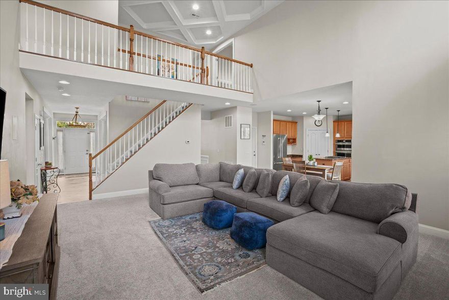 $25.00 a Month Electric Bills alone make this a great value, the Solar panels are PAID OFF. 2025  LVP flooring on main level and 2025  Carpet through out the house--Stunning 4-bedroom, 3.5-bath Colonial situated on a private .64-acre lot in Bristow. This home perfectly blends a classic layout with modern efficiency, featuring fully-paid solar panels, new flooring and carpet on all levels, and premium, pest-resistant attic insulation. 
Inside, the two-story great room serves as the heart of the home, showcasing a magnificent coffered ceiling and an abundance of natural light. The chef’s kitchen is equipped with Jenn-Air appliances, a large center island, and a walk-in pantry, flowing seamlessly into the main living area. Traditional formal living and dining rooms perfect for hosting.
The upper level boasts an enormous primary suite with an extra-large walk-in closet and a spa-like ensuite bath featuring a soaking tub, separate shower, and double vanity. Three additional bedrooms, a full bath, and a conveniently located laundry room complete this floor.
The finished walk-out lower level is designed for recreation, offering space for a game table and a large media area, plus a dedicated room perfect for a home gym. Outside, enjoy a massive deck overlooking a level, expansive yard—ideal for entertaining. There is ample parking in the cul-de-sac and a long, private driveway that adds seclusion. 
Walgreens, restaurants, a dentist and more are conveniently located right at the end of the street.