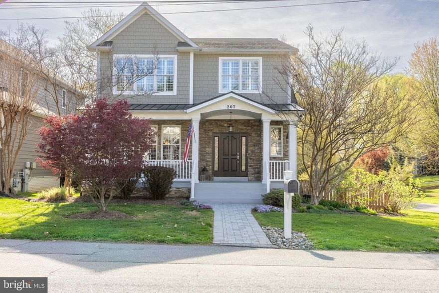 This classic craftsman sits on a quiet corner of the desirable Homewood neighborhood, known for its tree-lined streets and easy access to downtown Annapolis.  The stone and Hardie style exterior, paired with flowering landscaping and plantings in the front and backyards, gives the home a polished and welcoming presence.  A wide front porch sets the tone for warm and functional layout inside the home.
The main level features wood floor, a light-filled living room with a gas fireplace, and an open kitchen with a large island and stainless -steel appliances.  (The kitchen appliances were replaced in 2022).  You will be cooking with natural gas! Dining area with table seating for 10 guests.   Separate den/office with doors provides privacy for work or study.  Plantation shutters and crown molding add a clean finished look throughout, reflecting the home's well-maintained condition.
with 4 bedrooms and 3.5 baths, the home offers flexibility for a range of needs.  The primary suite includes recently added hardwood floors, a large walk-in closet, jetted soaking tub and separate shower.   Three additional bedrooms and a conveniently located laundry room complete the upper level.  The finished lower level adds even more usable space with recessed lighting, a full bath and room for a media area, play space or workout zone.
A screened porch with wood ceiling opens to the fenced-in-backyard, ideal for dining in warmer months.  The detached two-car garage includes overhead storage.  
The Homewood community is well located in the City of Annapolis with walkability to USNA Stadium, public library, restaurants, coffee shops and historic district. Quick access and connections to major commuting routes to Washington and Baltimore.