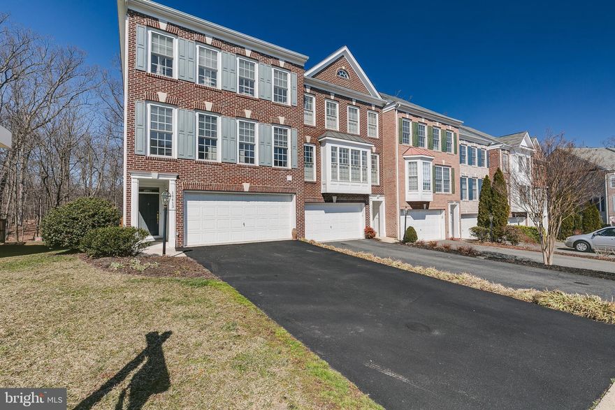 PREMIUM LOT backs to Woods/very private END UNIT! Upgraded Fenwicke Model Shows Great! * End & Palladium Windows, lots of light/bright! Fenced rear yard, patio & deck all back to wooded privacy * NEW carpeting was just installed * Hardwoods on Main * Gourmet Kitchen w/SS Appliances/Dbl Oven/Cooktop & Granite Countertops * 9' Ceilings * Vaulted Ceiling in Master BR * Luxury Tile Bath w/jetted soaking tub * Lower Lvl Game/Rec Rm w/Full Bath & Gas Fireplace * Alarm System installed/not in use conveys AS-IS) * Large side yard!