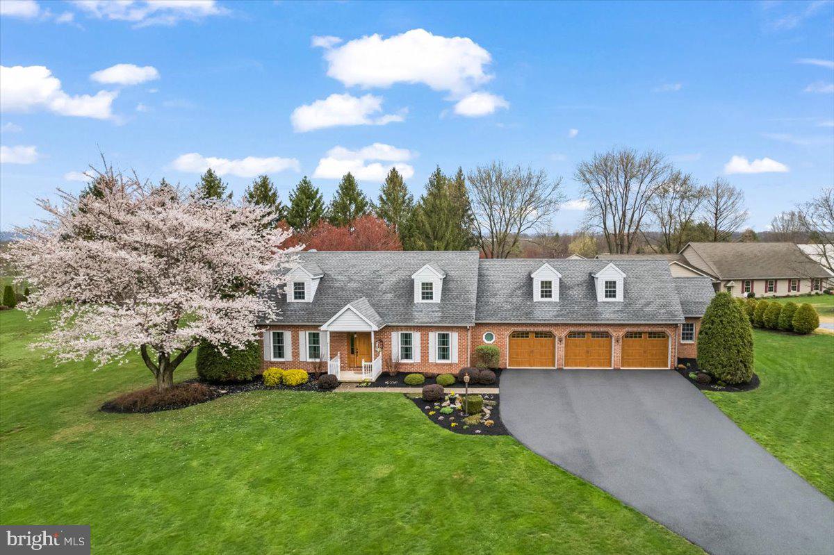 Captivating Custom Cape (2539 SF) with 3-car garage + separate workshop (1232 SF). Nestled on a picturesque one-acre setting w panoramic countryside views. Discover a one-of-a-kind gem tucked in a peaceful rural setting. Very low traffic. This meticulously maintained custom Cape Cod home offers timeless charm and standout features throughout. Brick front. Spacious 3-car garage includes an attached workshop—perfect for hobbyists, car enthusiasts, future pool house or extra storage. Step outside to your private oasis: a stunning hardscaped patio with a beautiful built-in fireplace and pergola, ideal for entertaining or quiet evenings under the stars. Hot tub included. Spacious back yard for future pool or volleyball courts. Inside, the heart of the home is a kitchen w plenty of cabinetry with massive breakfast bar island creating a space for gathering, baking cookies or creating your favorite dinners. Major appliances included. Spacious formal dining room could also be multipurpose space for study, office or toy room. Family room w area for additional everyday dining area. Main-level laundry room has door to backyard and easy access from garage. Half bath nearby too. Upstairs, the expansive owner’s suite impresses with a custom walk-in closet plus walk-in shower and generous space to unwind. With 3 bedrooms, 2.5 baths, and thoughtful touches throughout, this home offers both comfort and functionality. Spacious basement is unfinished (721 SF), a blank canvas for your finishing ideas. Homes like this rarely come on the market. (POSSESSION contingent upon sellers' new home completion expected in or about August 15. (Possession changed to Aug 25 on April 25 in agent remarks + Agent notified). The well is located in back yard near patio. Septic is to front of home near lamp post. In past, volleyball court was between shed and workshop area. Request seller summary of improvements. The interior is gorgeous too and the 3-car garage, the workshop, the patio, the backyard are the icing on the cake. Located in North Lebanon Township and within the highly regarded Cedar Crest School District (CLSD), this property offers easy access to shopping, dining, and schools. Low traffic area yet minutes to everything! Commuting is a breeze, with Hershey Park and Hershey Medical Center just 20 minutes away, and Harrisburg, Lancaster, and Reading all within 30 minutes. Lebanon VA Medical Center and Well Span Hospital are a few miles away. Centered between Lebanon and Hershey areas. Very close to Lebanon Valley Community College & historic Annville. Professional & specialty medical suites within a few miles to west or east. Philadelphia approx. one hour away. Baltimore and New York City are all within a few hours’ drive. Lovingly cared for by the original owner since it was built. Don’t miss your chance to make it yours!
