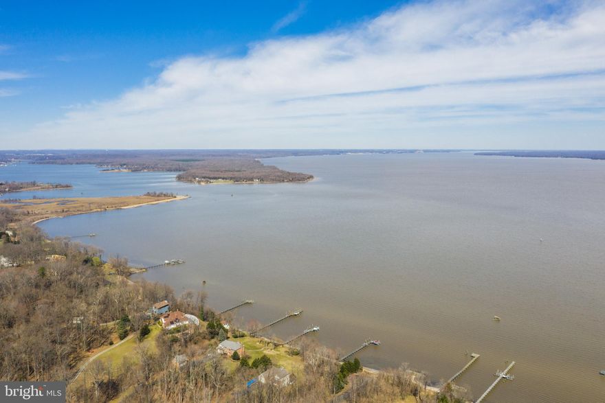 Rare opportunity to build your Waterfront Dream home!   A 3 acre waterfront lot with 300 ft pier located in an established exclusive neighborhood.  Private sandy beach.  The homesite  was previously perc tested for 5 bedrooms but it has expired.  Will need well and septic installed.  Electricity is currently run to pier and the uninstalled boat lift conveys.  Gravel driveway and entrance gate.  Less than 5 miles to Brook VRE Station.  Convenient access to I95 and Fredericksburg and D.C.   Come home to a peaceful waterfront paradise with a clear view of the night  stars!  Check out the aerial video by clicking on camera icon.  Please ask agent for topography map, septic layout and water management pond.  Now that breakwater was built and the dock area planting are mature, the beach and dock are protected and the pond can be filled in.