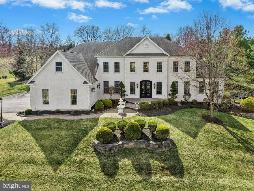 Nestled amid rolling hills just minutes from the Delaware River, the Gilded Nest spans nearly two acres within distinguished Woodside Estates. The exceptional location offers the ambiance of a neighborhood setting, effortless access to key commuter routes, and proximity to recreational and cultural hot spots. 

     Wood floors, custom millwork, and walls of windows bring warmth and light to the home’s beautifully appointed interiors and expansive floor plan. At the center of the main level, the soaring Great Room invites you to relax around a dramatic floor to ceiling gas fireplace and built-in entertainment center.  A formal dining room flows to the gourmet kitchen thoughtfully designed with a central island, walk-in pantry, double ovens, and gas cooktop. The sun-filled conservatory is a relaxing space for guests to gather. Upstairs, four en suite bedrooms offer comfort and privacy, including a luxurious primary suite with a sitting area, jetted soaking tub, and dual private water closets. Entertaining extends to the fully finished lower level, unparalleled in style and luxury with a stunning home theater, custom wet bar, fitness room, family room, office, and full bath. 

     Convenience, culture, and leisure come together just moments from home. A vibrant mix of dining, shopping, arts and outdoor recreation venues are nearby and daily living has hospital campuses, universities and business headquarters in the Lehigh Valley and New Jersey easily reachable.