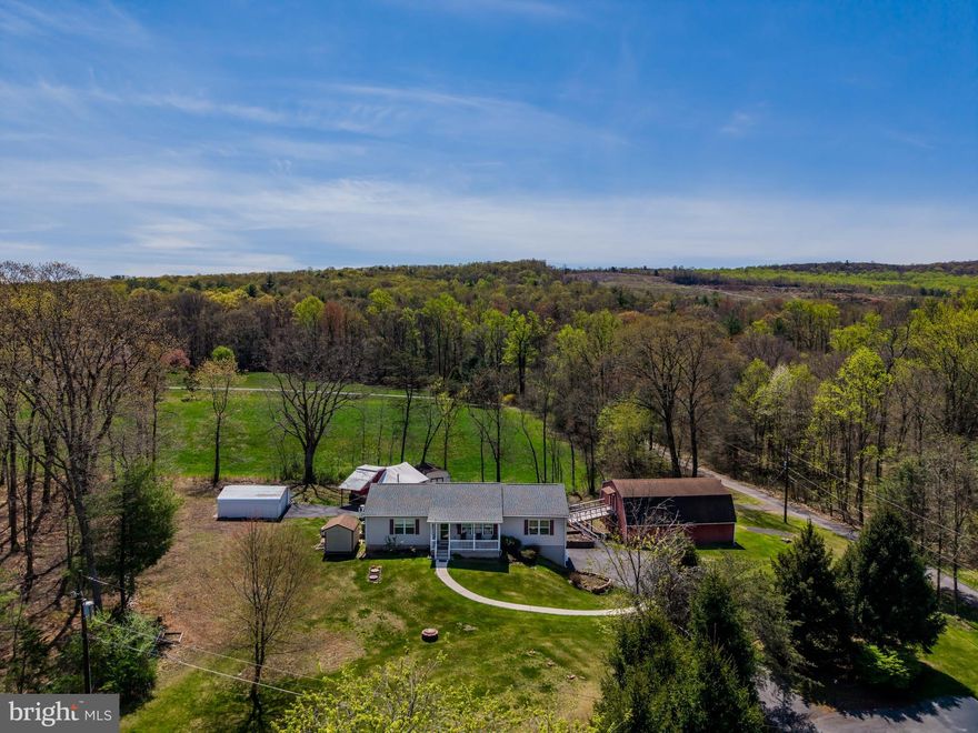 Charming Ranch on 1 Acre with Outbuildings & Country Views (Professional photos will be uploaded by 4/24/25)

Tucked away at the end of a quiet cul-de-sac, this single-story ranch home offers peaceful country living on a picturesque 1-acre lot in Lower Paxton Township. With 3 bedrooms, 2 full baths, and multiple outbuildings, the property is a perfect blend of comfort, functionality, and rural charm.

Inside, you'll find brand new flooring throughout most of the main level, spacious rooms with generous closet space, and a bright sunroom that opens to a screened-in back porch—ideal for morning coffee or evening relaxation. The kitchen and adjoining dining area overlook the private backyard, while the full basement with high ceilings provides endless potential for future living space, a workshop, or storage.

An oversized attached 2-car garage features high ceilings and ample room for vehicles, tools, or projects. Outside, the property includes a versatile collection of outbuildings: a two-story barn, two sheds, and a garage-style shed—perfect for hobbyists, storage, or small-scale agricultural use.

Additional highlights include a whole-house generator for peace of mind and a serene country setting that’s just minutes from shopping, dining, and major commuter routes.