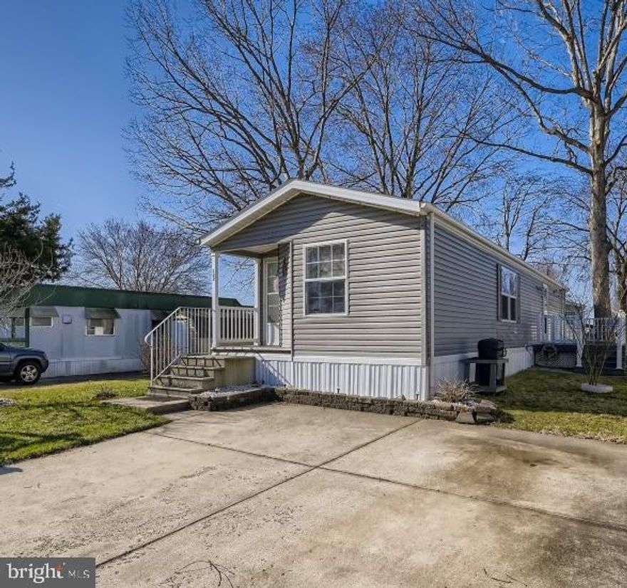 Looking for one floor living, less maintenance, stress, and a calmer lifestyle? Then this home is for you!! Meticulously maintained and barely lived in! This 2bd, 2 full bath home was built in 2004 and is approximately 15'x60' in size. Open concept floor plan with vaulted ceilings, skylights, and plenty of windows for the sun to shine in! Primary bedroom offers a large en suite bath and walk in closet. Newer trex deck off of the kitchen is great for relaxing or entertaining. Shed for extra storage space. 2 car driveway too! Completely move in ready. Your new home is waiting for you!! Schedule your showing today! Must be park approved to have your offer considered. Current lot rent is $810/month and is going up in June to $850/month. Seller would like a 30 day close date.