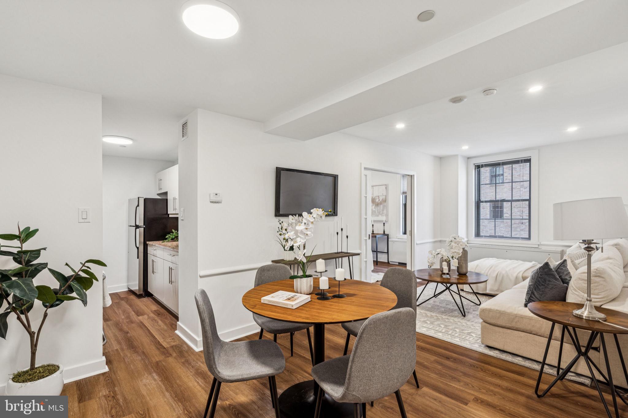 Rarely available and extremely efficient two bedroom, one bathroom with Center City skyline and Parc Rittenhouse pool views. Enter into a sunny great room with large coat closet and an oversized window, perfect for entertaining and everyday relaxing. Open to the great room is a galley-style kitchen with contemporary flat panel cabinetry, granite countertops, and stainless steel GE appliances. The spacious primary bedroom has two oversized windows offering excellent natural light and a very large wall closet. The second bedroom (or den), accessible through pocket doors off the great room, has another oversized window and two wall closets. Both bedrooms enjoy use of a marble-appointed hall bathroom. Additional home highlights include a laundry closet with stacked Asko washer/dryer, brand new vinyl floors and recessed lighting throughout, chair-rail and baseboard molding, and a fresh paint job. Residents of Parc Rittenhouse enjoy world class amenities and services including a 24 hour doorman; an amenities suite that includes a brand new state-of-the-art fitness center and resident lounge with pantry; media room; outdoor rooftop pool club with a large pool deck, full size pool, kids pool and hot tub; garage parking below the building for an additional fee; and two amazing restaurants on the ground floor, Stephen Starr’s Parc and Via Locusta.