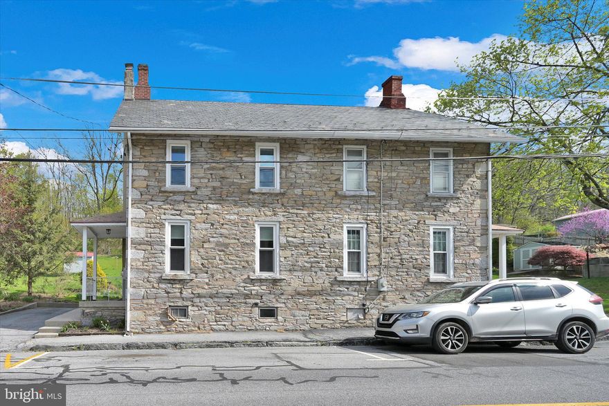 Beautiful stone home with new Kitchen with under cabinet lights, new 200 Amp service, whole house has been rewired and new windows.  Living room with brick hearth, ceiling fans throughout most of the home, covered rear patio and electric dog fence.