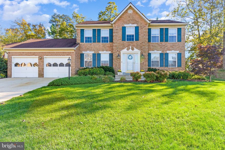 This Gorgeous Brick Colonial with over 2600 sf of living space.  Offering 4 bedroom, 2.5 bath also features a beautiful remodeled custom kitchen with new cabinets and upgraded custom granite countertops & back splash, lighting under the cabinets.  New upgraded Stainless Steel Appliances.  The kitchen and family room offer grand openness.  The family room has a cozy fireplace with gorgeous windows . You will love the custom built in cabinets in the living room.  The dining room offers two entrances and offers a traditional feel.  This home features extensive trim work throughout.  Harwood thought out the main level, staircase and upstairs hall.  The master suite has large vaulted ceilings, a large walk in closet with custom built in shelves, the master bath offer a soaking tub and separate shower.  This home was built with a 2ft additional bump out off the back side of this home to offering 80 additional  square footage.  The garage was converted from a two car garage into a one car garage giving you additional living space for a Recreation room, additional bedroom or man cave.  You can always convert back to a two car if desired.  The sellers have created a back yard oasis with a large deck and Sundance Hot Tub for evening enjoyment.  The back yard is private and offers a deck off the back property. Please see the fig tree on the side of the home that has been special to the family and has produced many figs over the years.   Home warranty is offered