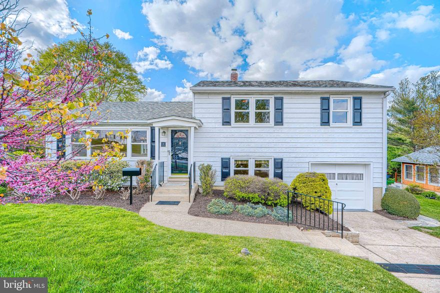 Immaculately maintained and filled with natural light, this beautifully expanded split-level home offers the perfect balance of comfort, style, and functionality. Freshly painted throughout in neutral tones, it’s completely move-in ready.  The main level living and dining rooms showcase gleaming hardwood floors that continue into the upper-level bedrooms. An updated eat-in kitchen is both stylish and functional, featuring granite countertops, stainless steel appliances, a tile backsplash, ceramic tile flooring, recessed lighting, and under-cabinet lighting—ideal for everyday living and entertaining. 

The true centerpiece of the home is the stunning main-level family room addition. Bathed in natural light, this inviting space boasts a vaulted ceiling with recessed lighting, plush wall-to-wall carpeting, and a cozy gas fireplace flanked by custom built-in shelving. A beautifully updated full bath is conveniently located just off this space.

Upstairs, you’ll find three well-appointed bedrooms with hardwood floors, crown molding, overhead lighting, and generous closet space. The lower level offers a comfortable retreat with a family room featuring wall-to-wall carpeting and recessed lighting—perfect for relaxing or unwinding. This level also includes a utility area with a flush toilet and direct access to the one-car garage for added convenience.

Outside, the home continues to impress with exceptional curb appeal and a meticulously maintained exterior. Enjoy easy access to the backyard from the maintenance-free deck off the family room, leading to a spacious flagstone patio. The fully fenced yard, complete with a charming wood picket fence and storage shed, provides a private, low-maintenance outdoor space perfect for entertaining or everyday enjoyment.