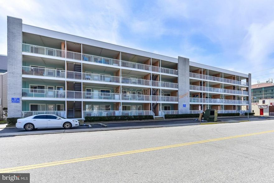 Incredible value-3 bedroom ocean block condo with an elevator under $190,000! Owner has done some updates-bamboo, wide plank, large ceramic tile flooring, newer cabinets and counter, removed popcorn ceiling and installed full insulation. Own an ocean block condo balcony and open floor plan for an outstanding price. Front and back entrances-can use stairs or elevator-See the ocean from the back entrance. Reserved parking space plus guest spots. North OC sought-after location with wide streets. Steps to beach, restaurants, movies, shopping(including tax free DE), mini golf, entertainment. Owner didn't rent, but awesome potential. Must See. As-is. Take Virtual Walk of Condo-3D TOUR on photo tab. #BeachBestBuy #OC (Agents follow instructions for showing)