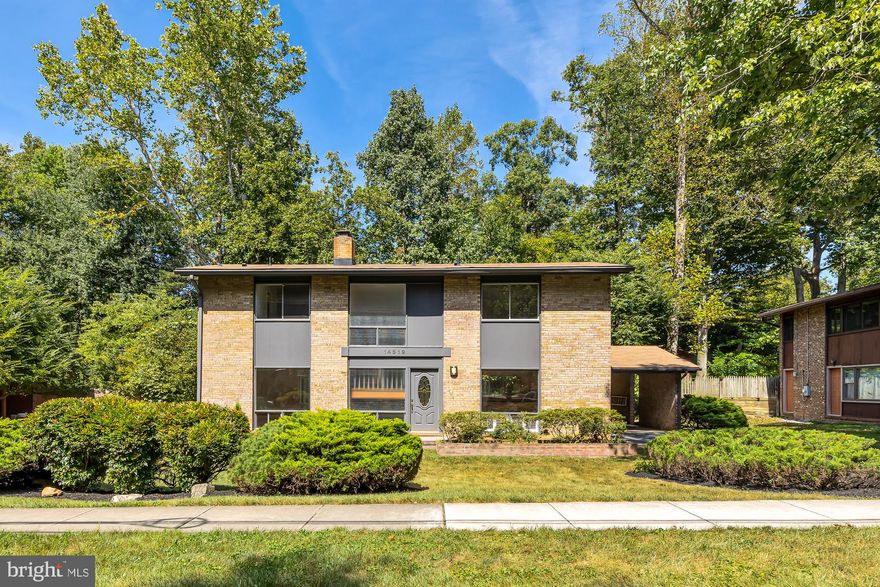 Do not miss this rare opportunity to own one of Manor Woods’ rarely available, sought after, Mid-Century moderns. Ready to be made into your dream home, this property offers 4 bedrooms, and 2.5 baths and has been lovingly cared for by the original owners.

The main level contains a generous-sized kitchen, ready to be renovated and opened to the dining room, and living room with cozy fireplace. The wall of floor to ceiling windows lead lead out to an expansive patio.  The lot is wooded and private, offering 9,200 square of property and leading directly into the kitchen for ease and convenience.

Large windows naturally illuminate the exposed brick and floating stairway up to the generous second level that is home to a primary suite with dual closets and en suite bathroom. Three additional bedrooms with roomy closets in each with a spacious hall bath complete this level.

Downstairs in the basement, you are greeted by a large recreation room with custom built-ins for storage and decor. To the right, you will find a generous, unfinished storage space giving you the opportunity to add another bedroom, or remodel. Build whatever fits your needs: additional living space, a home office, gym, studio, theater, or play area. This level also features a separate laundry/utility room with tons of potential.

This modern is located blocks to Manor Woods Swim Club, neighborhood schools and retail. Enjoy access to Rock Creek Park within the community which leads all the way in to DC. Close to Red Line Metro and the Intercounty Connector. This property is an estate sale and being sold AS-IS.