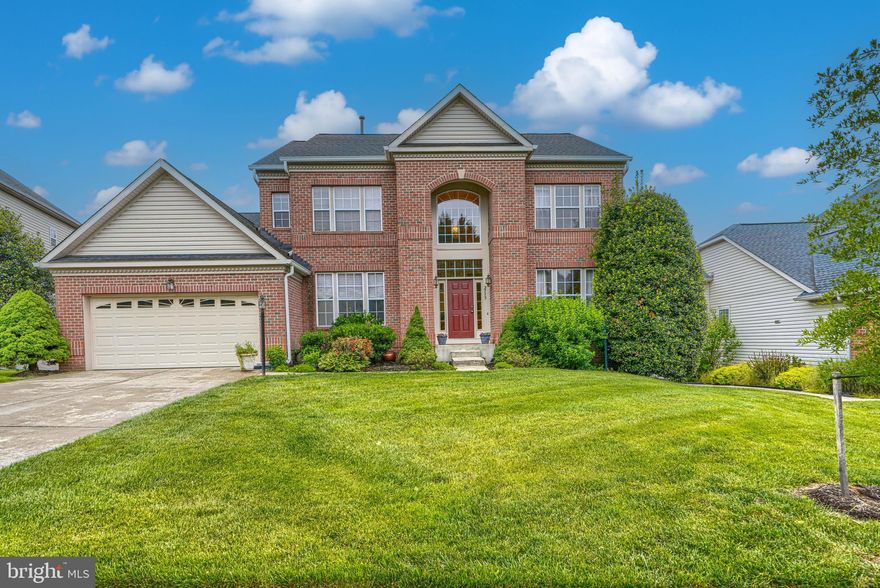 List price is Opening Bid at The Online Only Auction Sale to Be Held on The Auctioneers Website – Bidding begins Saturday June 6, and ends Thursday, June 11, 2026 at 12:00 PM. Exceptional brick-front colonial in the highly sought-after Daniel Mill’s Overlook community of Ellicott City. Situated on a beautifully landscaped 0.25± acre lot backing to Patapsco State Park, this impressive residence offers nearly 4,600± total square feet with 4 bedrooms and 3.5 baths, combining elegant living spaces with exceptional indoor and outdoor entertaining areas. Additional highlights include an oversized 2-car garage and peaceful wooded views. A grand two-story foyer welcomes you into the home, featuring rich hardwood floors, crown moldings, bay windows, and French doors throughout. The main level includes formal living and dining rooms, a private office, spacious laundry room, and convenient powder room. The gourmet chef’s kitchen is designed for both everyday living and entertaining, featuring stainless steel appliances, double ovens, a large center island with seating, breakfast bar, and built-in desk area. The kitchen opens to a soaring family room with a gas stone fireplace and access to the expansive deck overlooking the private backyard. The upper level offers four spacious bedrooms and two full bathrooms, including a luxurious owner’s suite with cathedral ceilings, a large walk-in closet, and spa-inspired en suite bath with dual vanities, soaking tub, and enclosed shower. The finished walkout lower level provides a large recreation and entertainment area, full bathroom, and versatile bonus room ideal for a guest suite, gym, or media room. Outside, enjoy ample green space, a play area, and serene wooded surroundings. Conveniently located near top-rated schools, parks, shopping, dining, and major commuter routes including Route 29, I-70, and Route 100, this remarkable home offers luxury, comfort, and convenience in one of Howard County’s premier communities.