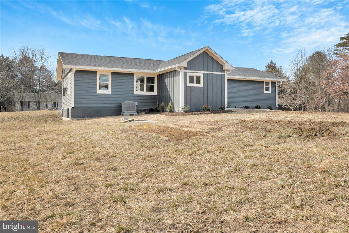 Welcome to a rare gem in Stephens City! This unique single-family home sits on 5.5 private acres, blending wooded serenity with cleared, flat, usable space—perfect for entertaining family and friends. Low-maintenance living awaits with durable Hardie Plank siding, a new roof, insulated crawl space and attic, and an upgraded gutter system. Enjoy morning coffee on the front patio or host dinners on the private back patio, where deer sightings and peaceful views create a perfect backdrop.
Step inside through a striking front door to original hardwood floors flowing throughout this spacious 4-bedroom retreat. The bright, open living room and kitchen invite you in, offering ample table space or the option to add your own island. The kitchen shines with stainless steel appliances, butcher block counters, upgraded cabinetry, recessed lighting, and a window framing the expansive acreage. A generous laundry room provides convenience with direct access to the back patio. The primary suite is a cheerful haven, featuring a full bath with separate shower, double vanity, and recessed lighting. Three additional sizable bedrooms share the second full & expanded hall bathroom.
The crown jewel of this property is the expansive 1200 sf 4-car garage with vaulted ceilings and its own meter and electrical panel—a versatile space ready to adapt to your dreams. Finish the inside to be an apartment and rent it out - options are endless.
Perfect for car collectors, it can house classics, an RV, or boats with room for lifts or a loft. DIY enthusiasts will love the potential for an auto shop, woodworking studio, or artisan workspace, while entrepreneurs can transform it into a business hub, warehouse, or rental income source. Imagine a home gym, game room, or entertainment haven, with the soaring ceilings accommodating climbing walls or dramatic decor. From seasonal storage to a music studio or indoor garden, this one-of-a-kind garage offers endless possibilities for hobbies, passions, or practical needs—all just steps from your private 5.5-acre retreat.
