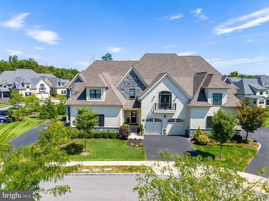 Introducing the Devon model at The Reserve at Creekside, an unparalleled residence
epitomizing the height of refined living. This magnificent home features 3 bedrooms, 3
full baths, and 1 half bath, w/over 3,950 sq. ft. of exquisitely upgraded space across
three distinguished levels. Upon entry, you’re immediately enveloped in an open floor
plan that exudes elegance and grandeur. Expansive Living Room boasts pristine White
Oak hardwood floors, a regal tray ceiling, intricate crown molding, and gas fireplace, all
of which contribute to an ambiance of lavish sophistication. Adjacent to this, the formal
Dining Room impresses with a custom tray ceiling, crown molding, and wainscoting,
providing an exquisite setting for hosting gatherings. Gourmet Kitchen is a culinary
masterpiece, featuring an impressive 12-ft island illuminated by oversized pendant
lights, custom extended cabinetry, and premium quartz countertops that extend up as a
backsplash. Top-of-the-line Cafe Series appliances—including French door double oven
and an additional two-drawer under-counter refrigerator—complement the space, which
also includes a generously sized custom walk-in Pantry, accessible from the
oversized 2 car Garage, offers a spacious foyer with custom coat closet and ample storage.
Tastefully designed Powder Room, adorned w/elegant grass cloth wallpaper. 
Large open Living Room with a tray ceiling, custom electronic blinds on the  sliding doors that open onto a sprawling Deck, also accessible from the Breakfast Area, which features a built-in banquette nook
w/white leather seating. Ascend the upgraded hardwood stairs to the 2nd level, where
the luxurious Primary Suite awaits. This retreat has a tray ceiling, detailed crown
molding, millwork, and two expansive custom walk-in closets. Spa-like Primary
Bathroom is a haven of indulgence, w/custom marble top with custom double vanity, an oversized
frameless marble shower w/gold fixtures, and a separate water closet. Two additional
generously sized Bedrooms, a spacious Hall Bathroom, and a meticulously appointed
Laundry Room complete this level. Enjoy the Full, Finished walk-out lower level offering
a generous living area, glass-surround gym, full bathroom, and provisions for a bar.
Added features include upgraded hardwood floors on the main level, recessed lighting,
bespoke light fixtures, custom window treatments, a comprehensive water softener
system. Situated between two esteemed Golf Clubs, Philadelphia Cricket Club and Whitemarsh Valley Country Club. The Reserve at Creekside offers an unrivaled lifestyle of maintenance-free
living complemented by world-class amenities. 4,500-sq. ft. Clubhouse features a
sophisticated Gathering Room w/gas fireplace, gourmet Kitchen, state-of-the-art Fitness
Center, and an Outdoor Pool. Perfectly located in Whitemarsh Township, this residence
provides effortless access to Fort Washington and Wissahickon Parks, the upscale
shops of Flourtown and Chestnut Hill, and major routes including 309, 476, and the PA
Turnpike. Schedule your private tour today.