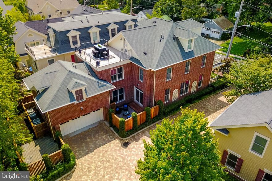 Location AND Luxury.  Rare sun splashed, all brick exterior, 5 BR single family on corner lot at prestigious Acton's Landing in dwtwn Historic  Annapolis. Attached 2 car garage AND 2 addt'l apron spaces. 4 zoned HVAC. Built 2006. Separate suite & bath for guest/nanny + roof top deck & priv. rear patio. 4 blocks from City dock, &1 block from Acton's Cove on Spa Creek.*OPEN HOUSE SUNDAY 9/3 1-4 PM*