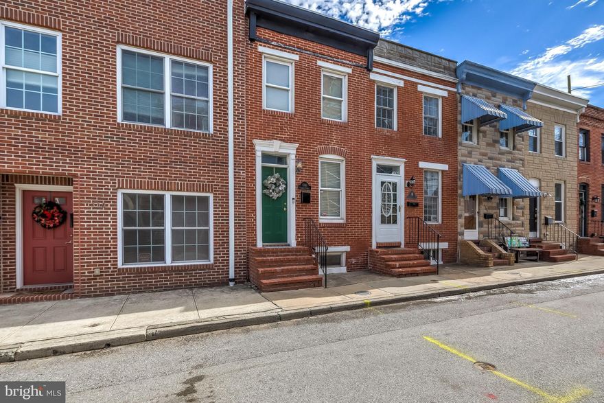 This beautiful, well maintained home is situated on one of Locust Point's most beloved blocks!  Featuring two bedrooms, two full bathrooms, two outdoor spaces, and lots of light!  The living room is the perfect place to relax after a long day, or you can enjoy eating, cooking, or entertaining in the spacious kitchen with breakfast bar!  The primary bedroom has it's own private balcony, and the second bedroom has tall ceilings with all of the natural light!  Laundry is conveniently located on the bedroom level!  Plenty of spaces to work from home, with additional storage downstairs.  Walkable to all of Locust Point's best restaurants, Latrobe Park, Fort McHenry, Under Armour, McHenry Row, and more!